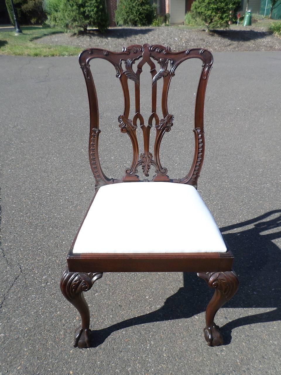 Set of six Chippendale mahogany dining chairs, made by Merryweather & Sons, early 20th century, all marked with a brass plaque on the back seat rail, made of dense, heavy mahogany and beautifully carved cabriole legs ending in ball and claw feet.