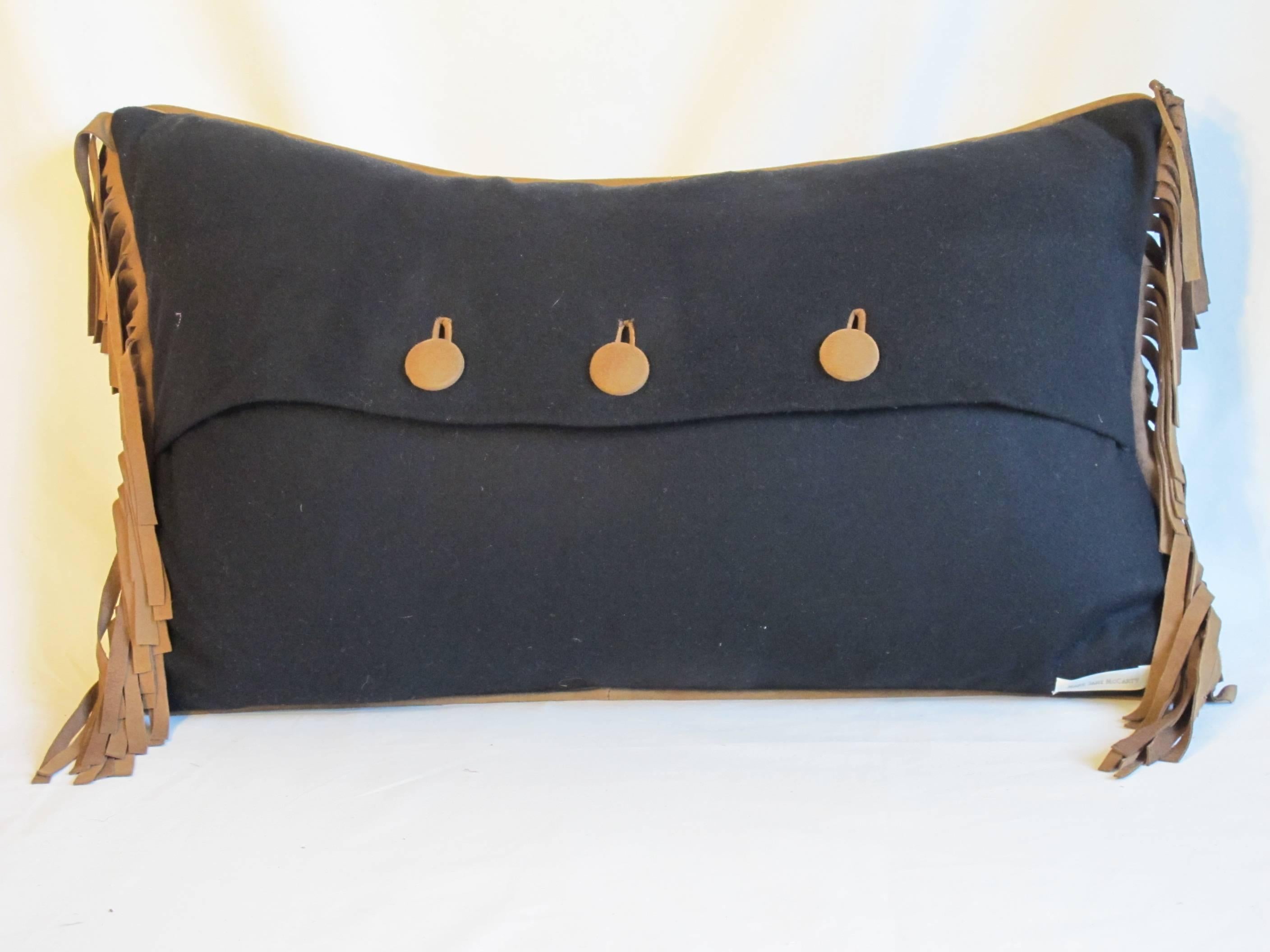 Lumbar pillow made from an authentic vintage burberry wool throw, embellished with suede fringe, a covered button closure, down insert is included. $485 each.