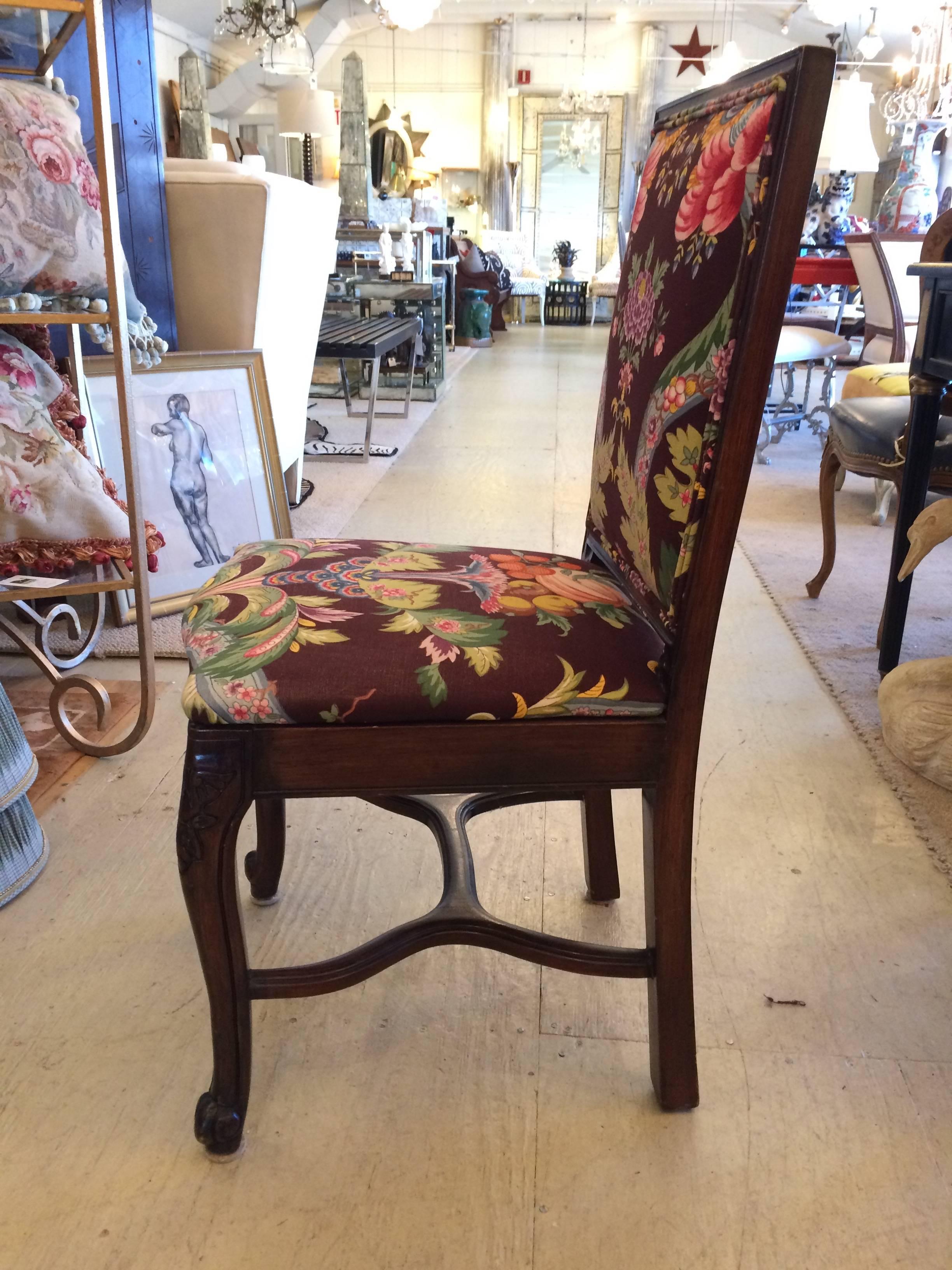 Wonderful French country carved mahogany dining chairs with old world charm, updated with zippy Brunschwig and fils upholstery.