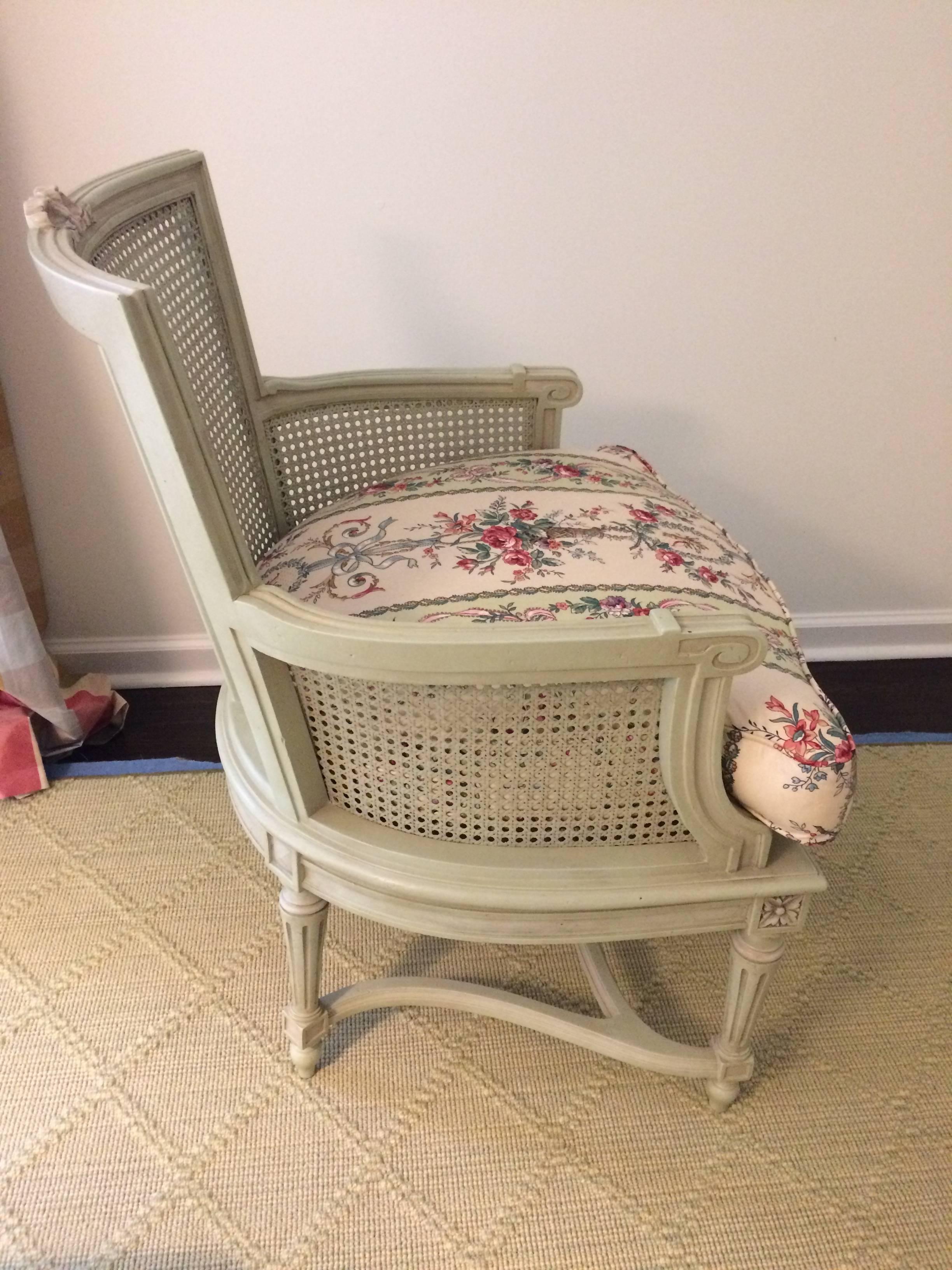 Lovely antique caned and carved armchair hand-painted in the Elizabeth O'neil school of painted finishes in a soothing celadon green. Cushion is Schumacher fabric.