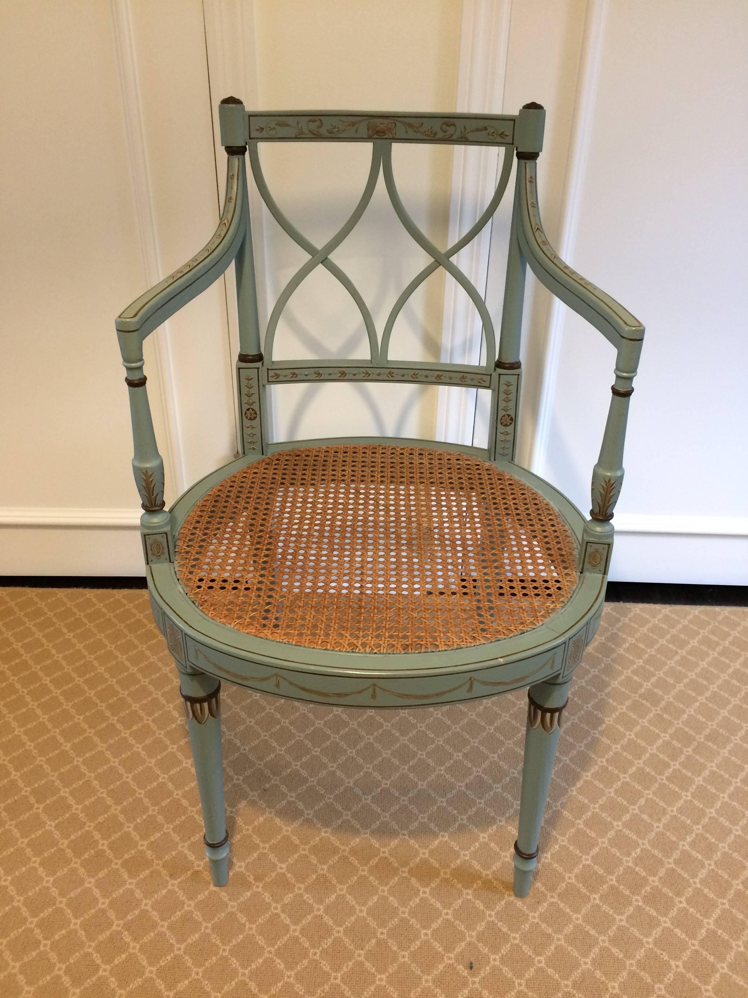 Celadon green and gold painted chair with caned seat and curved 
