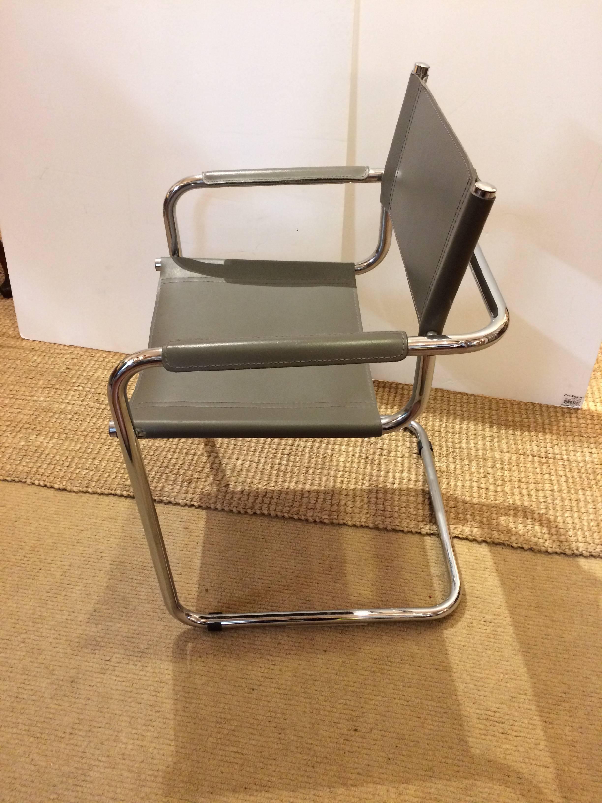 Four super cool Italian chrome and grey colored leather armchairs with a director's chair style. Great as dining chairs or living room too!
 