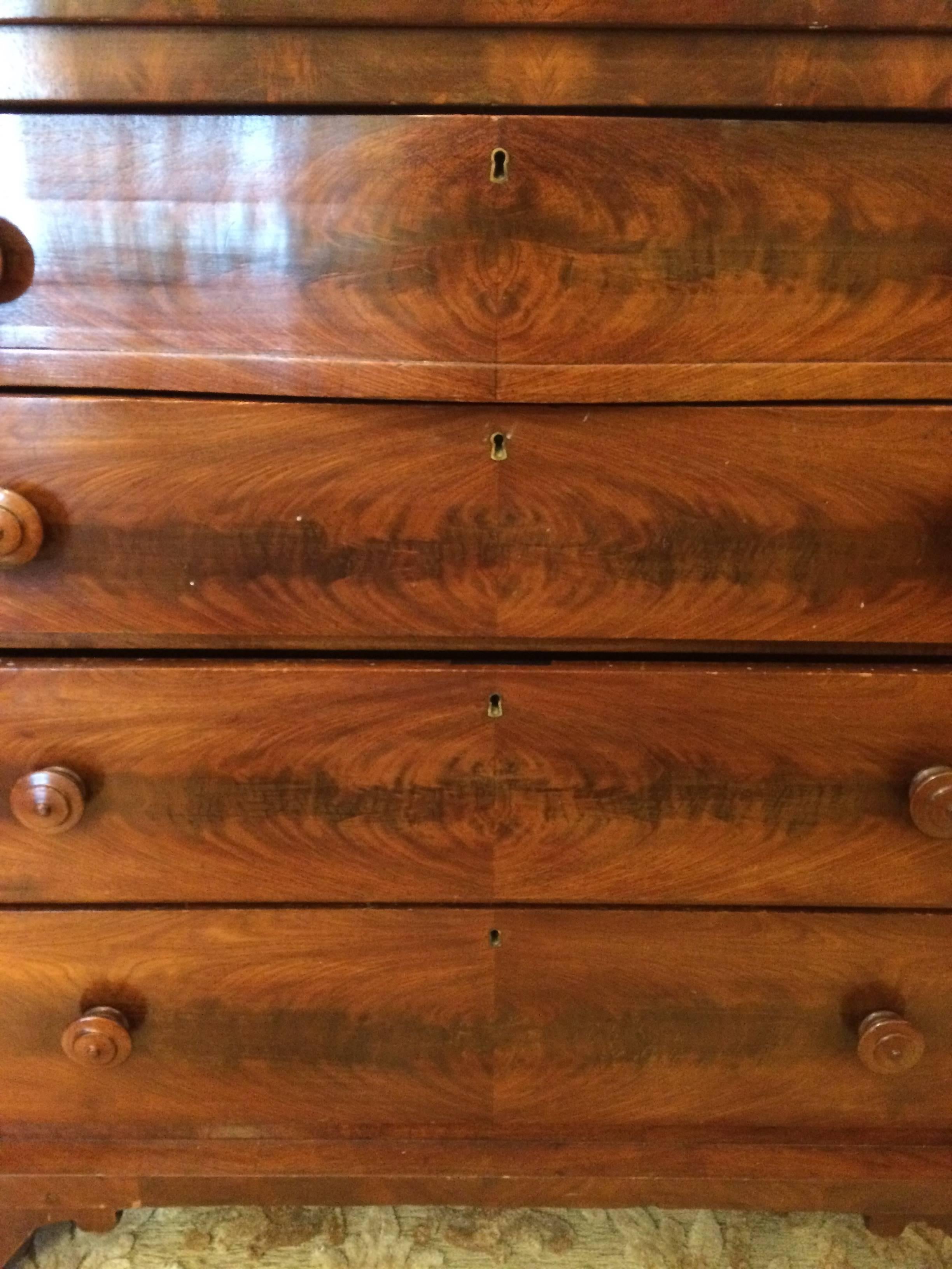 Solid heavy and Classic chest of drawers with beautiful grain and Empire style, having four large drawers that work smoothly.