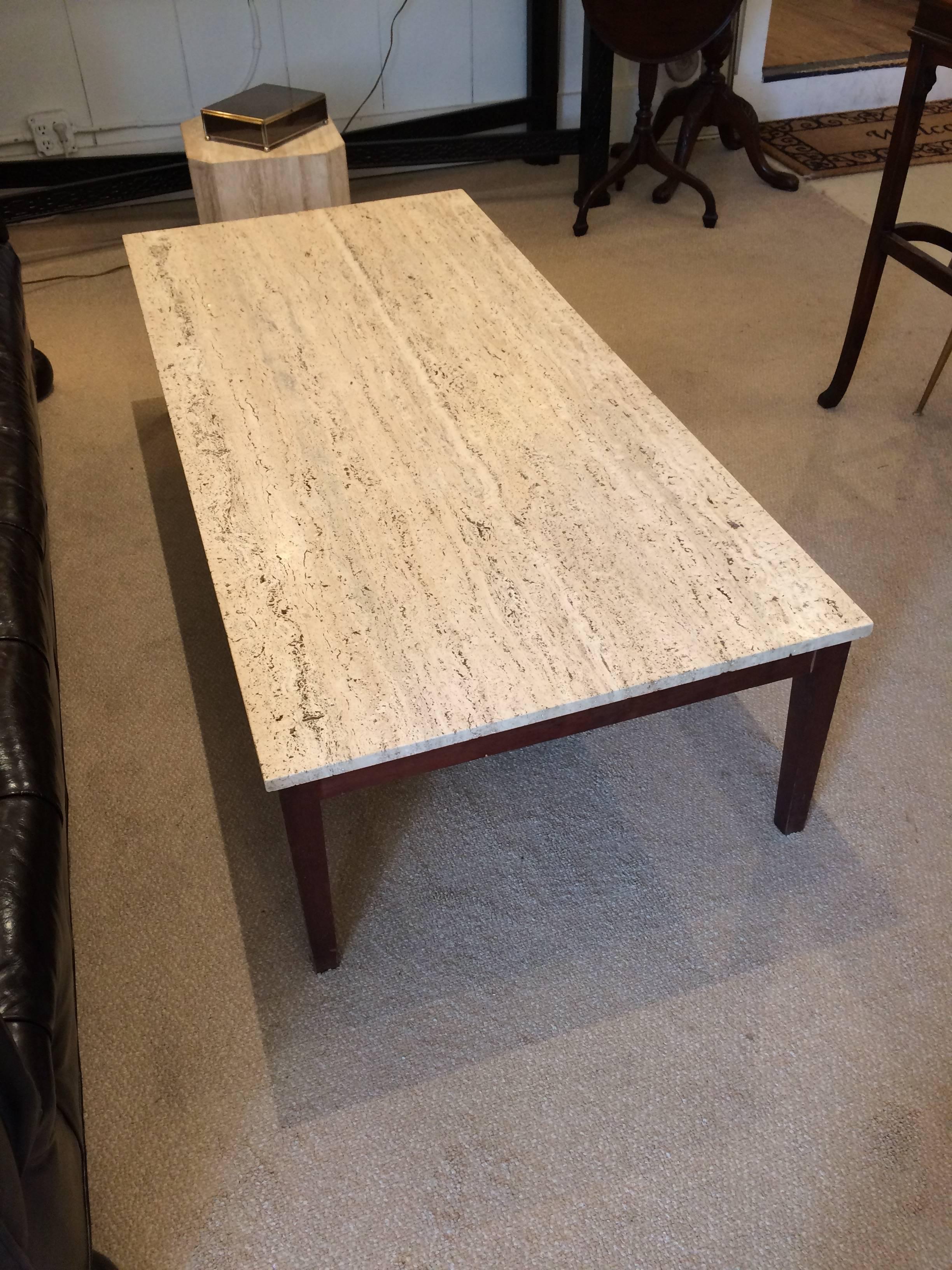 Beautiful Mid-Century Modern coffee table with clean lines and sleek look. Legs are teak and top is a handsome slab of travertine.