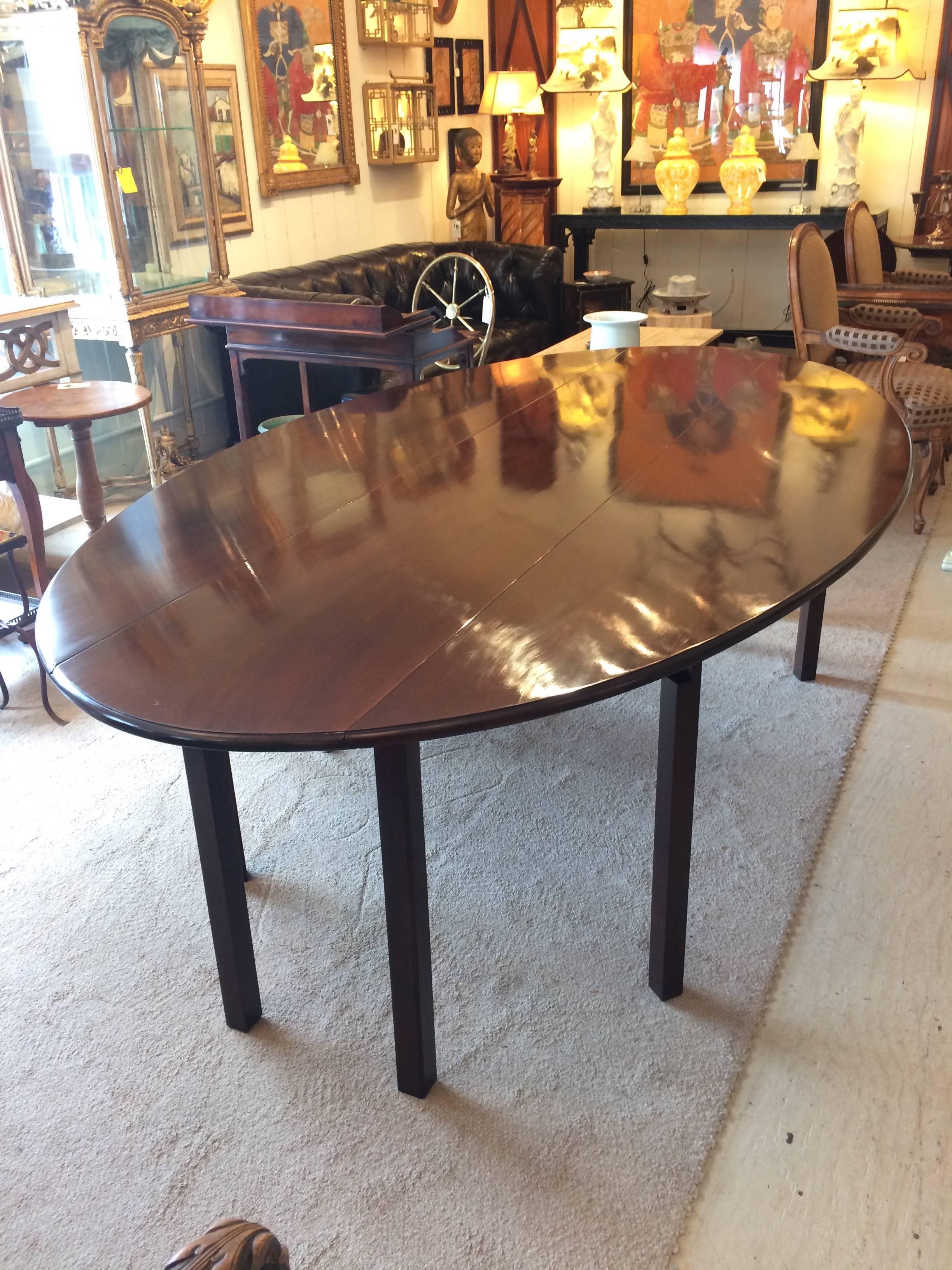 Sublime solid dark mahogany 8 foot gate leg table, with beautiful oblong shape when fully open, with two drop leaves, shrinking to a narrow 16.5 D when both leaves are down. Could be used as a sofa back table or very long console.
Sides lift up to