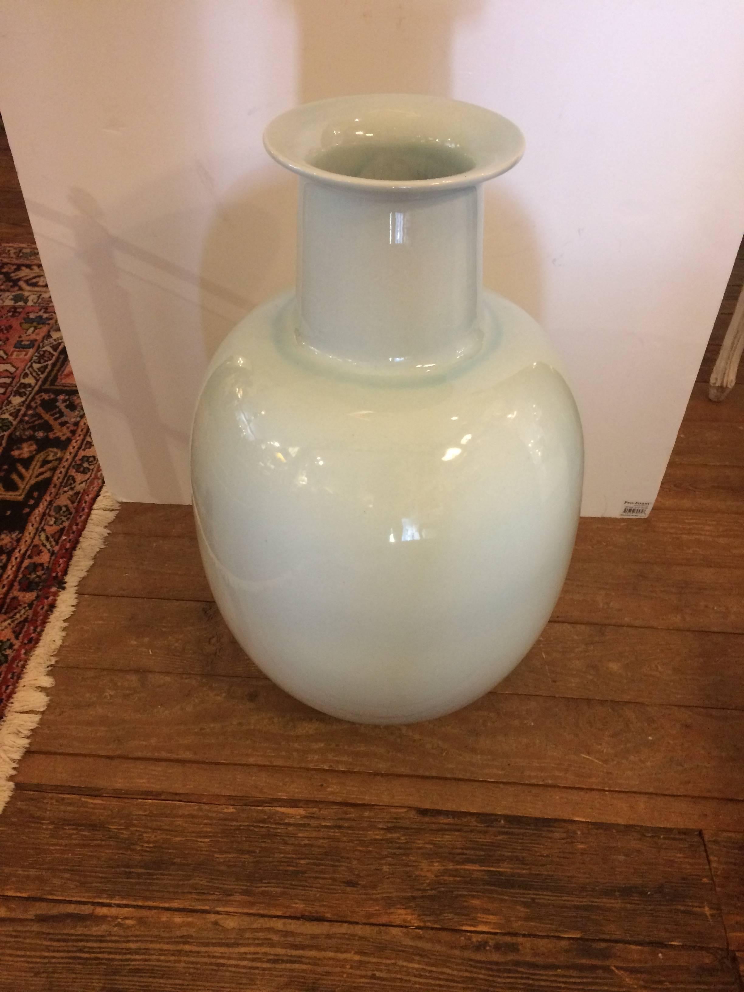 A very large lovely porcelain vessel in a cool soft shade of celadon or the lightest blue green. Opening is 9