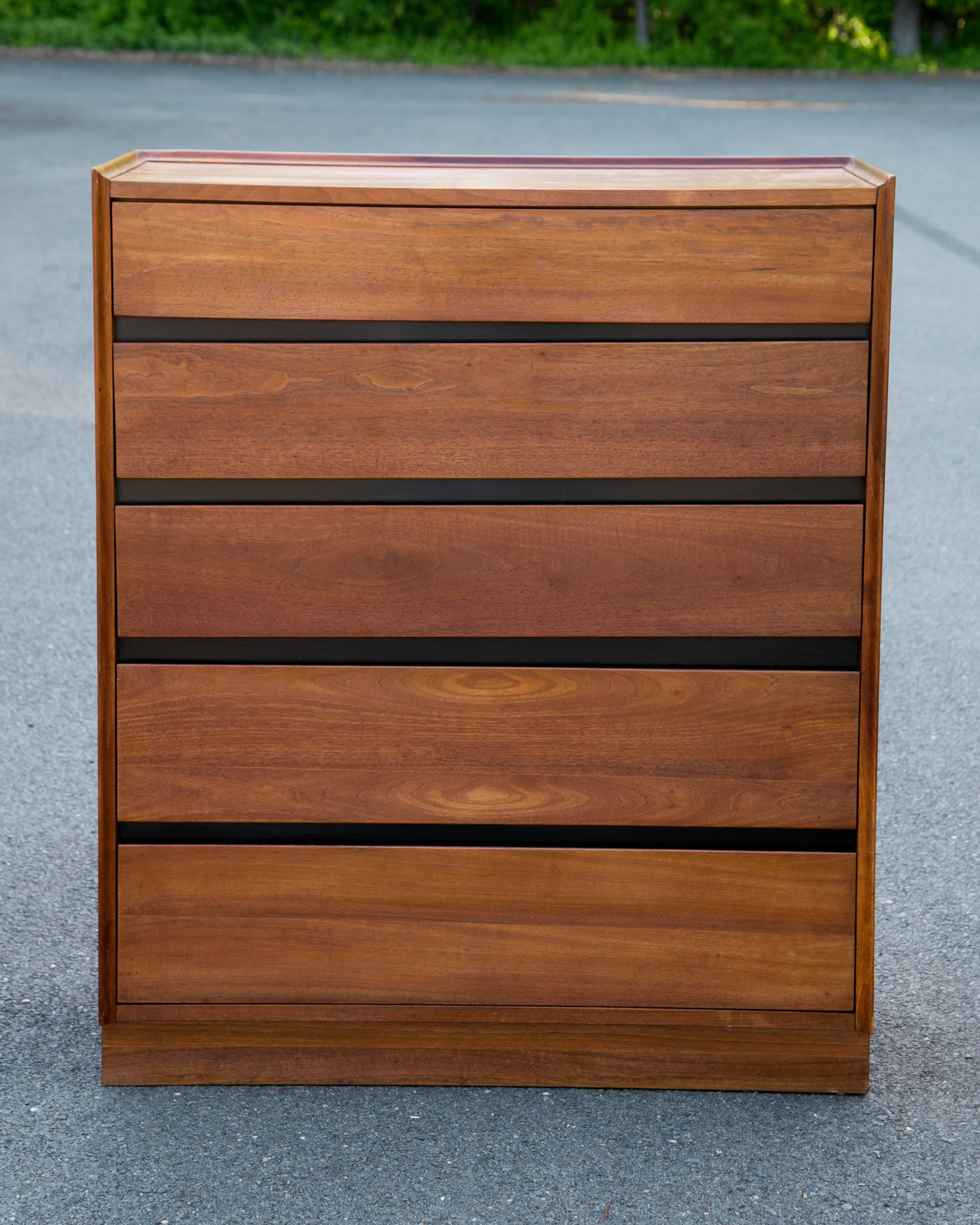 Sleek Mid-Century modern walnut highboy dresser and matching pair of night stands, Dillingham Esprit is the maker, often attributed to Milo Baughman but in fact designed by Merton L. Gershun.
Walnut wood grain with black framed drawers.
Highboy