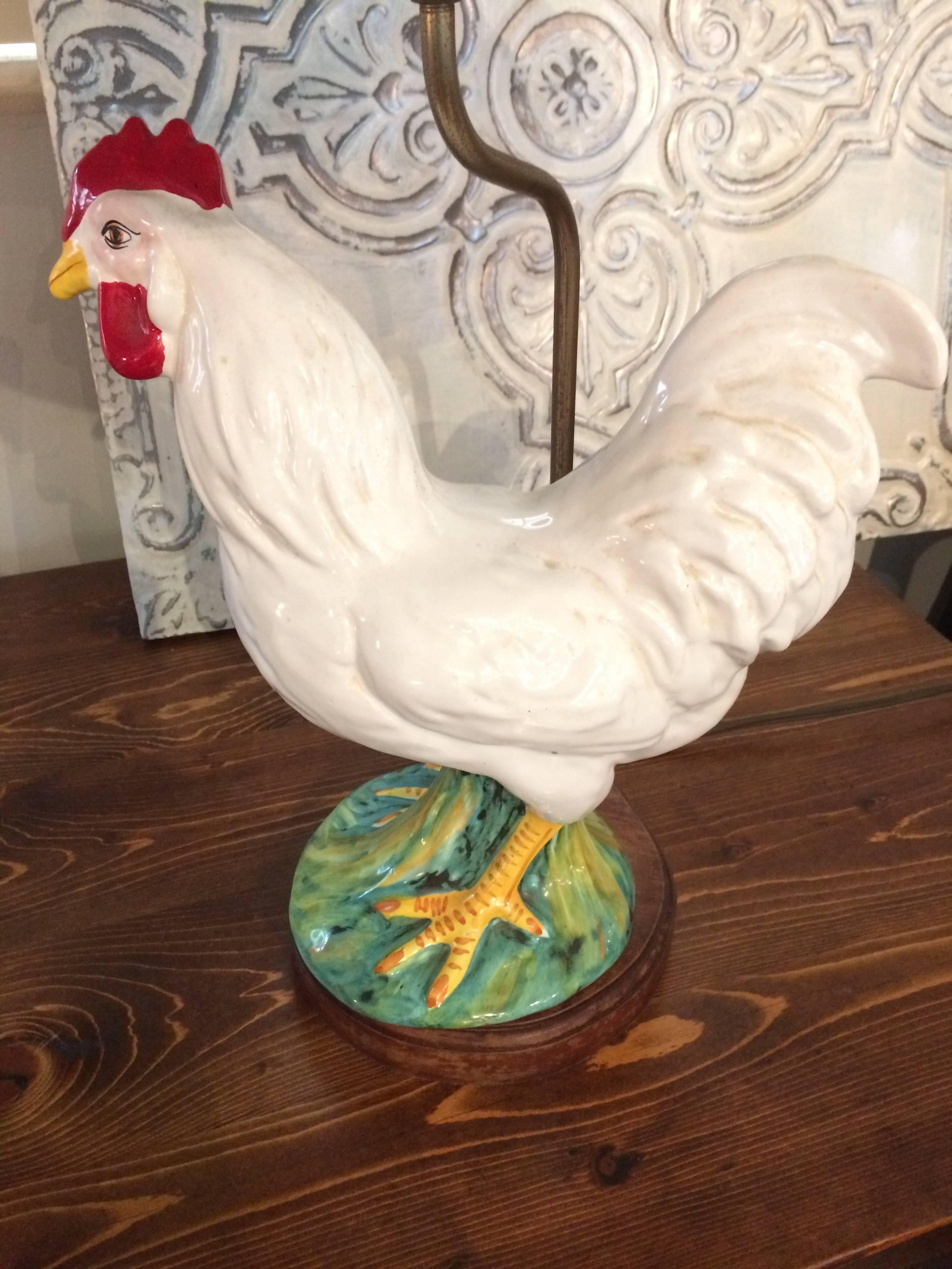 Two sculptural ceramic rooster table lamps, each unique and mounted on wooden bases, with pleated custom shades.

Measure: Roosters are 11.25 W and H
8 inch D bases.


 