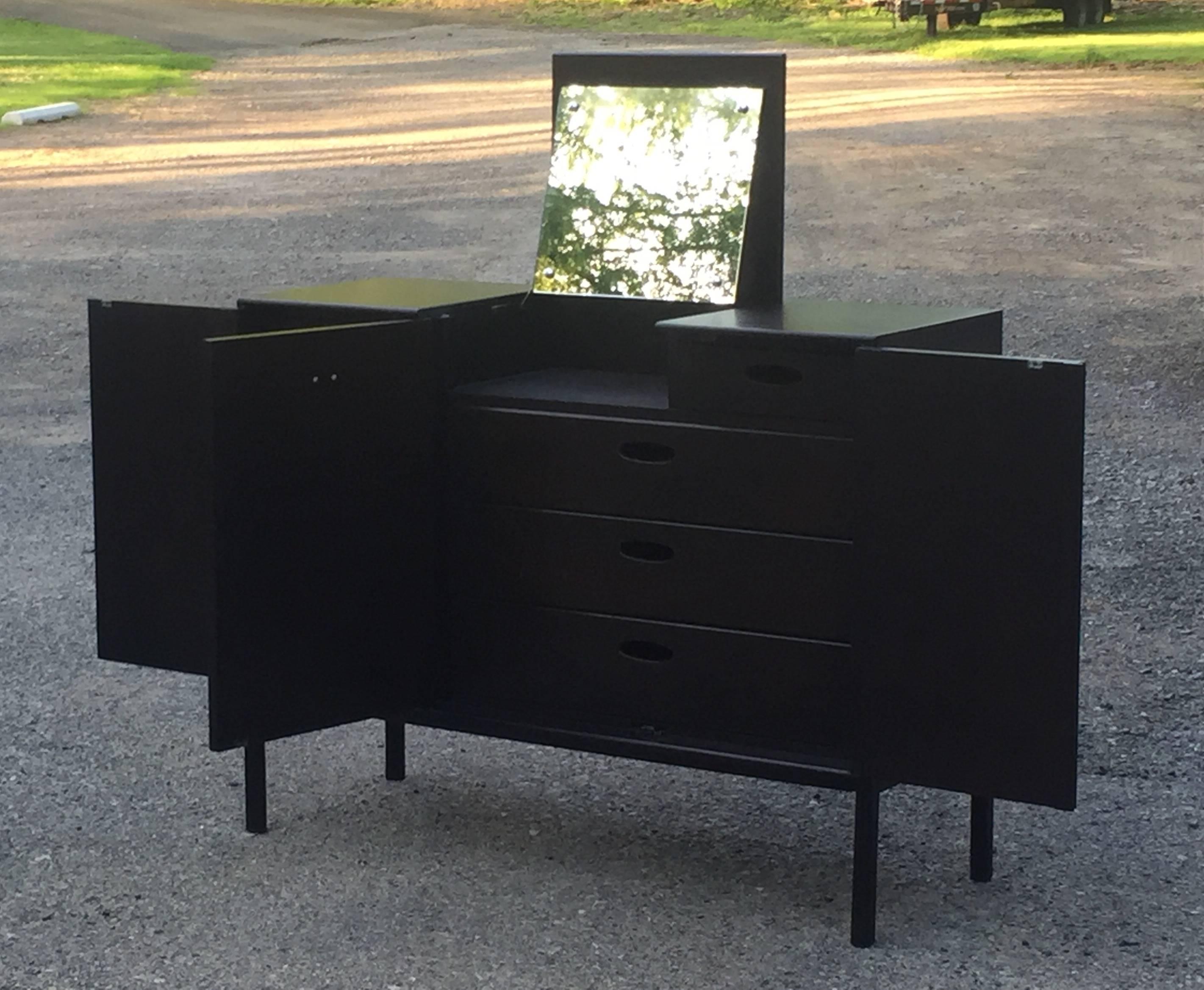 Sleek eight-drawer John Stuart dresser with vanity mirror, mahogany with a dark almost black finish.