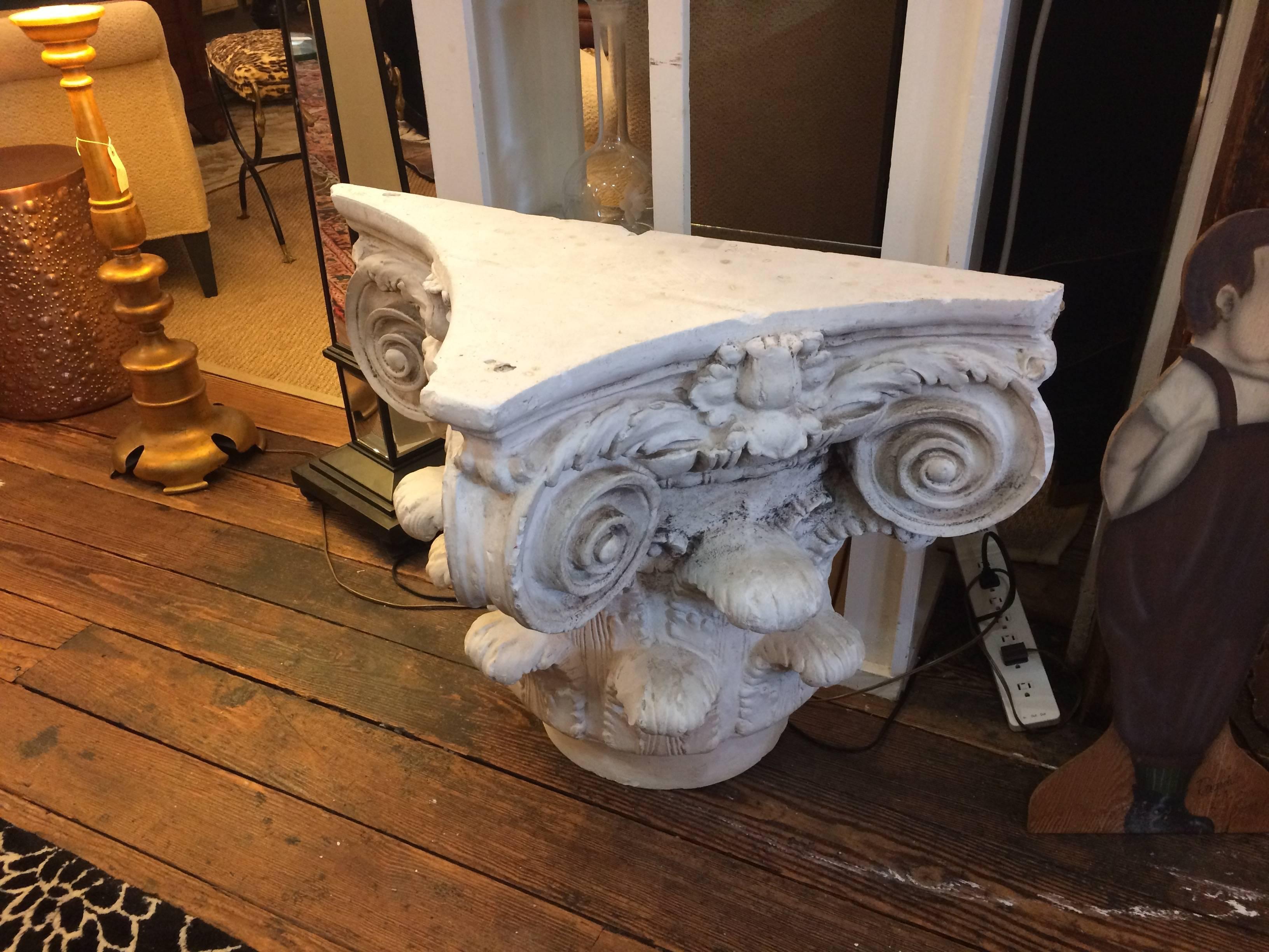 Wonderful three sided accent table made from a found plaster column top with scrolly decorative design.
