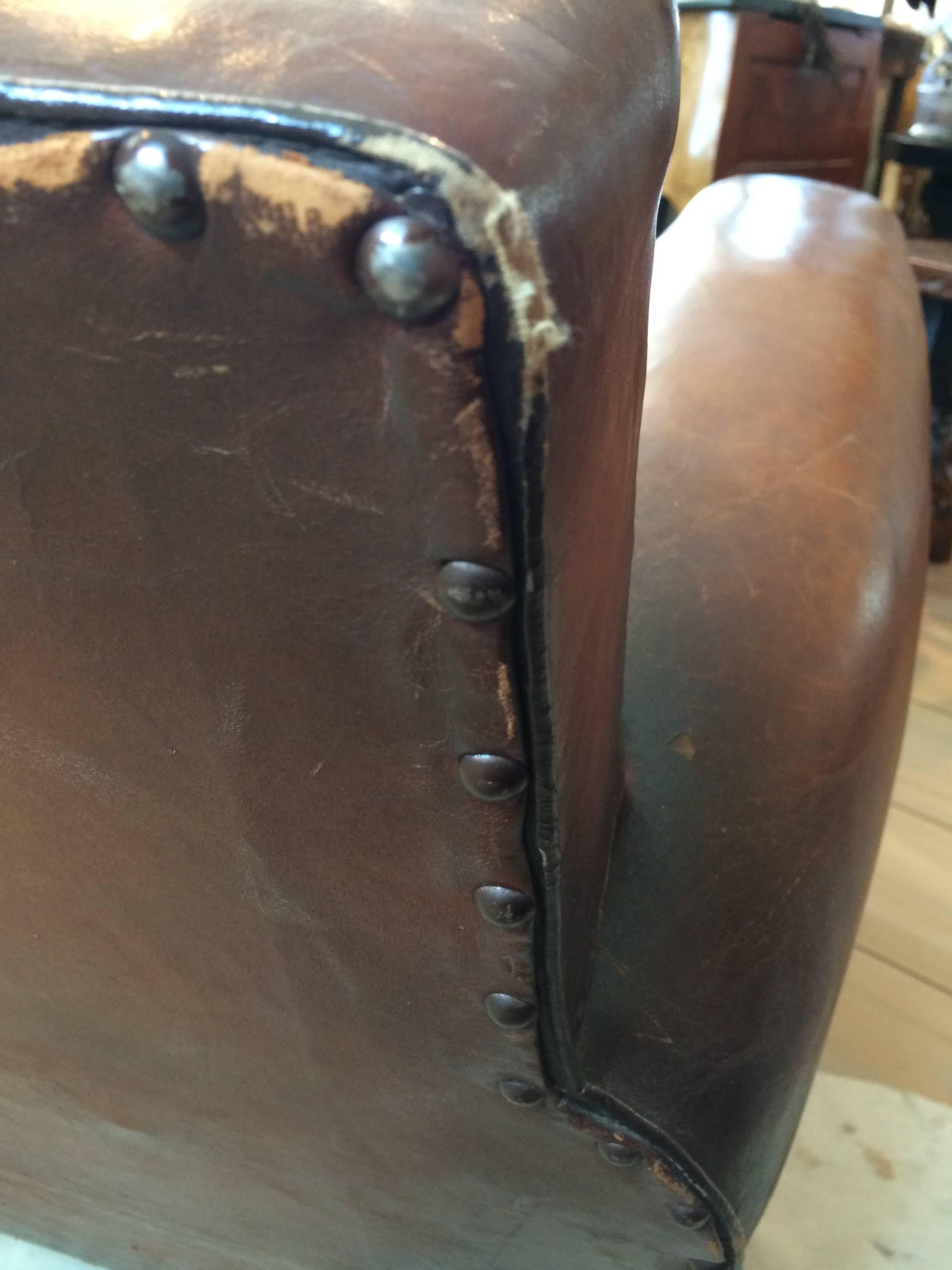 20th Century Authentic Pair of Distressed French Vintage Moustache Style Leather Club Chairs