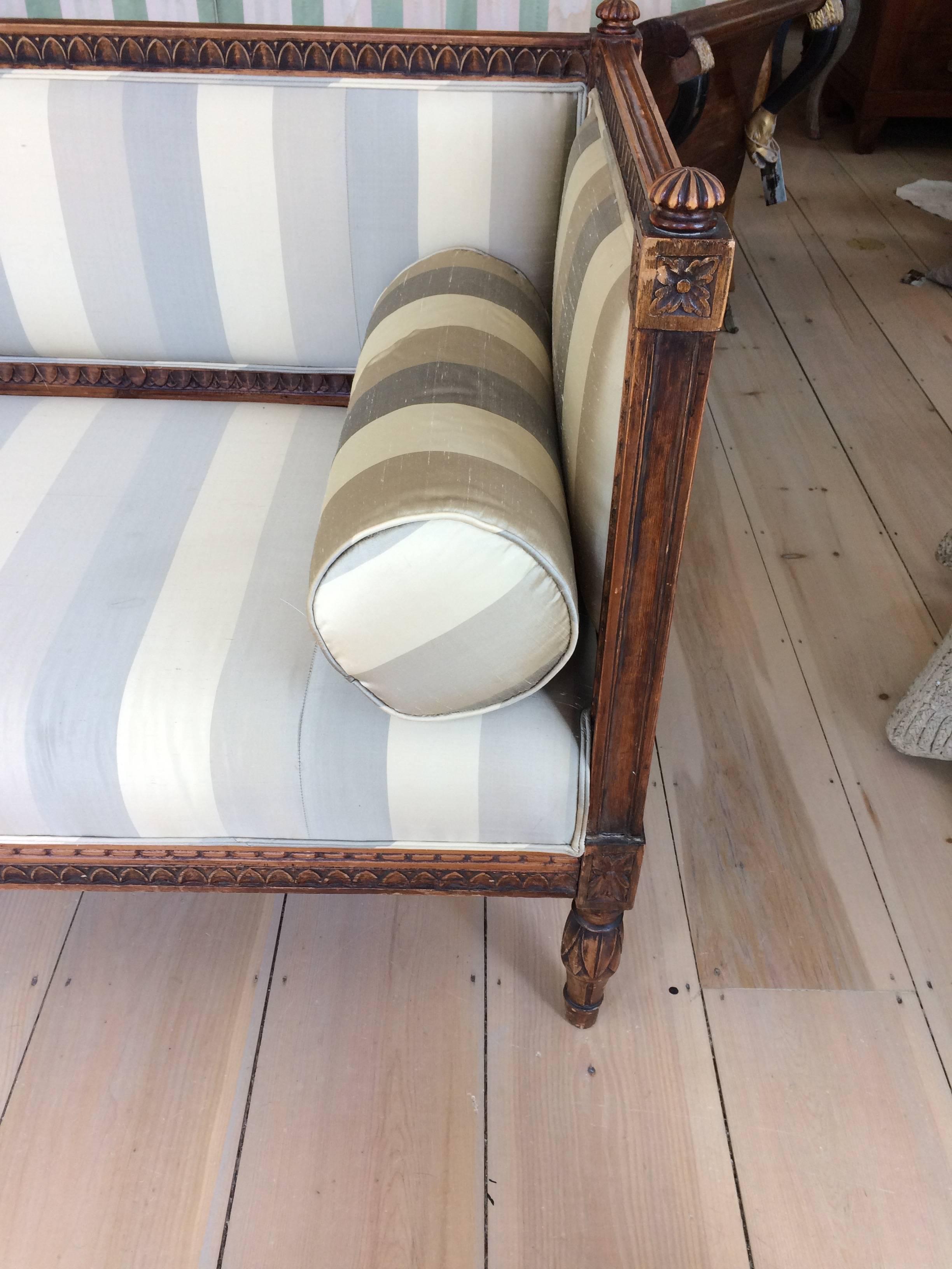 Swedish Gustavian sofa – never been painted! A Swedish period Gustavian 19th century sofa upholstered in silk striped fabric. 
Measures: height of back 33.25; to finial 34.25
seat depth 23.