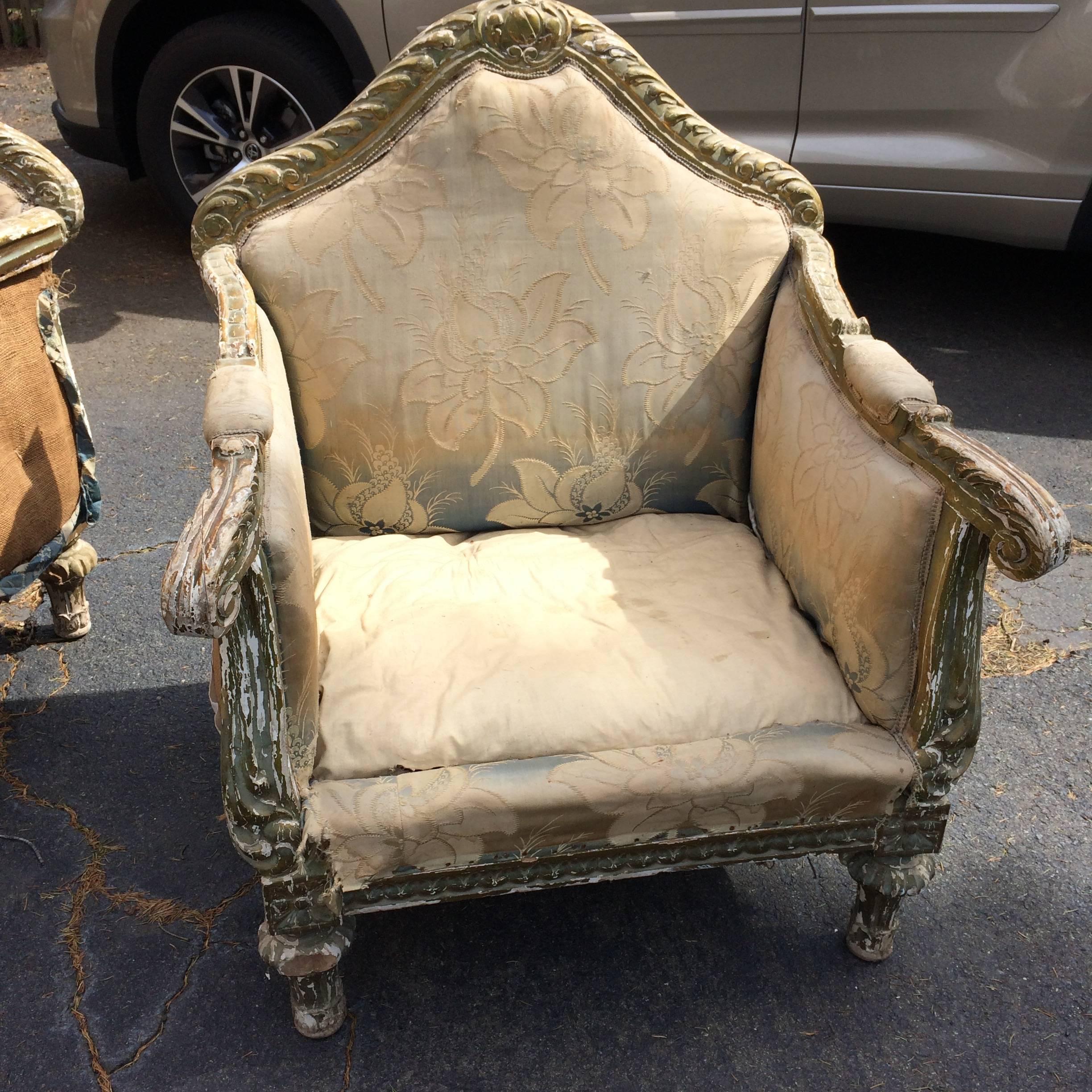 Two very large regal club chairs that need a good upholsterer but have refined elegant structure, original distressed paint on elaborately carved frames and window pane back. Priced accordingly. Seat depth 23.75
Note: There are four side dining