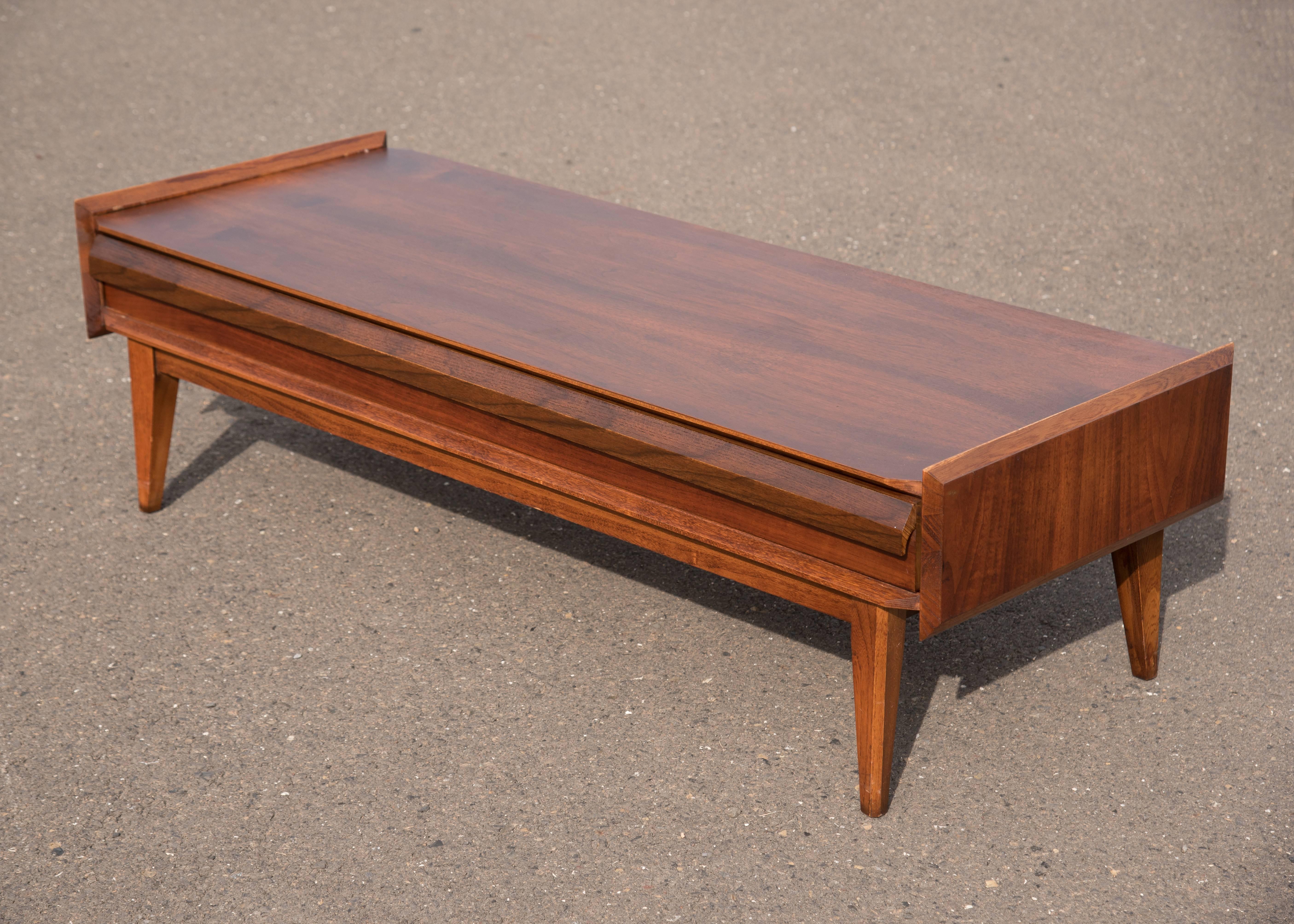 Modernist figured walnut and pecan cocktail table attributed to Andre Bus for Lane. Classic modernist design, wonderful figured walnut, superior quality and construction.
 