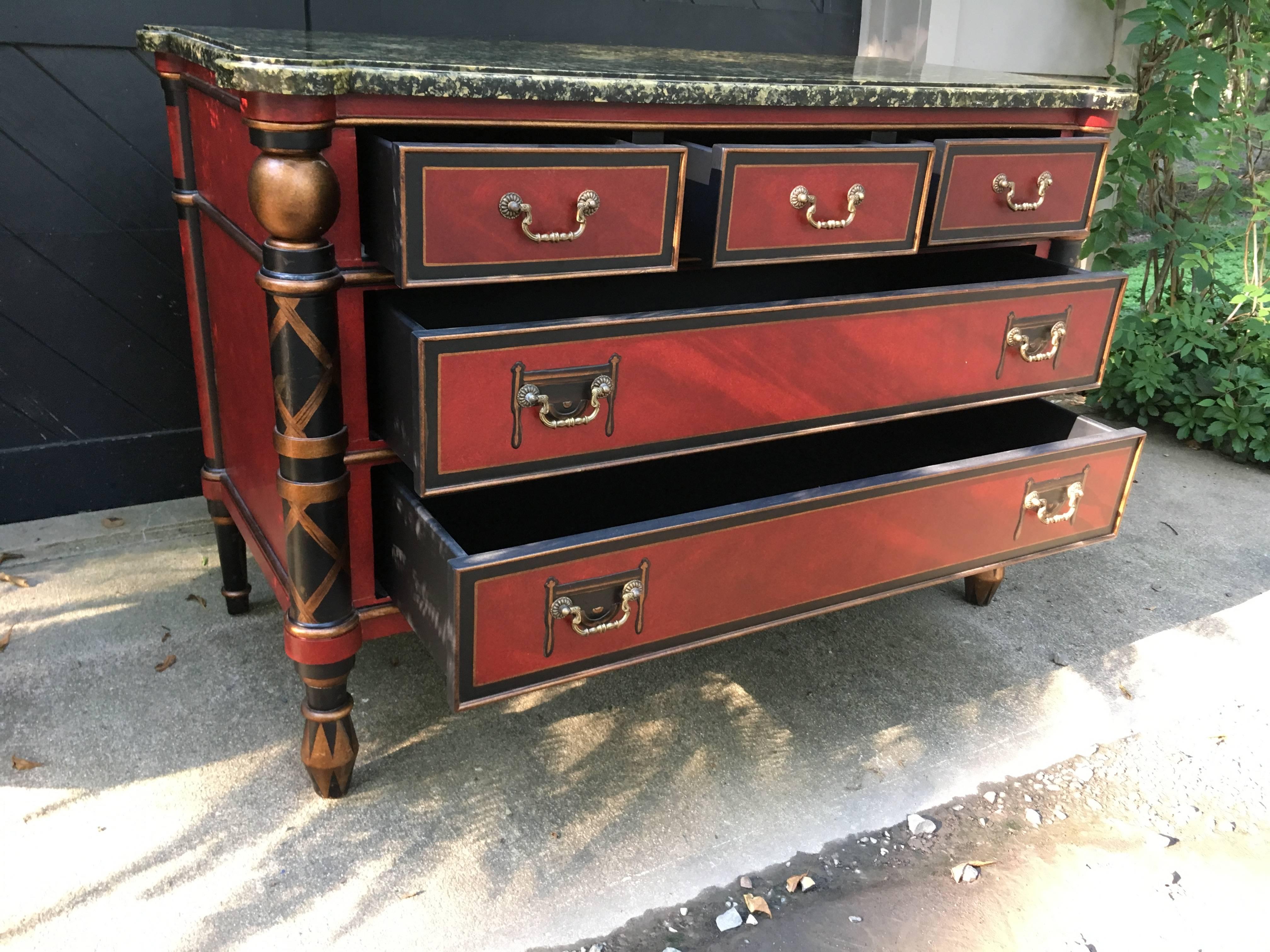 Stunning Regency style chest hand-painted in eye catching Chinese red, black and gold, by Chelsea House. Three small drawers over two full length drawers.