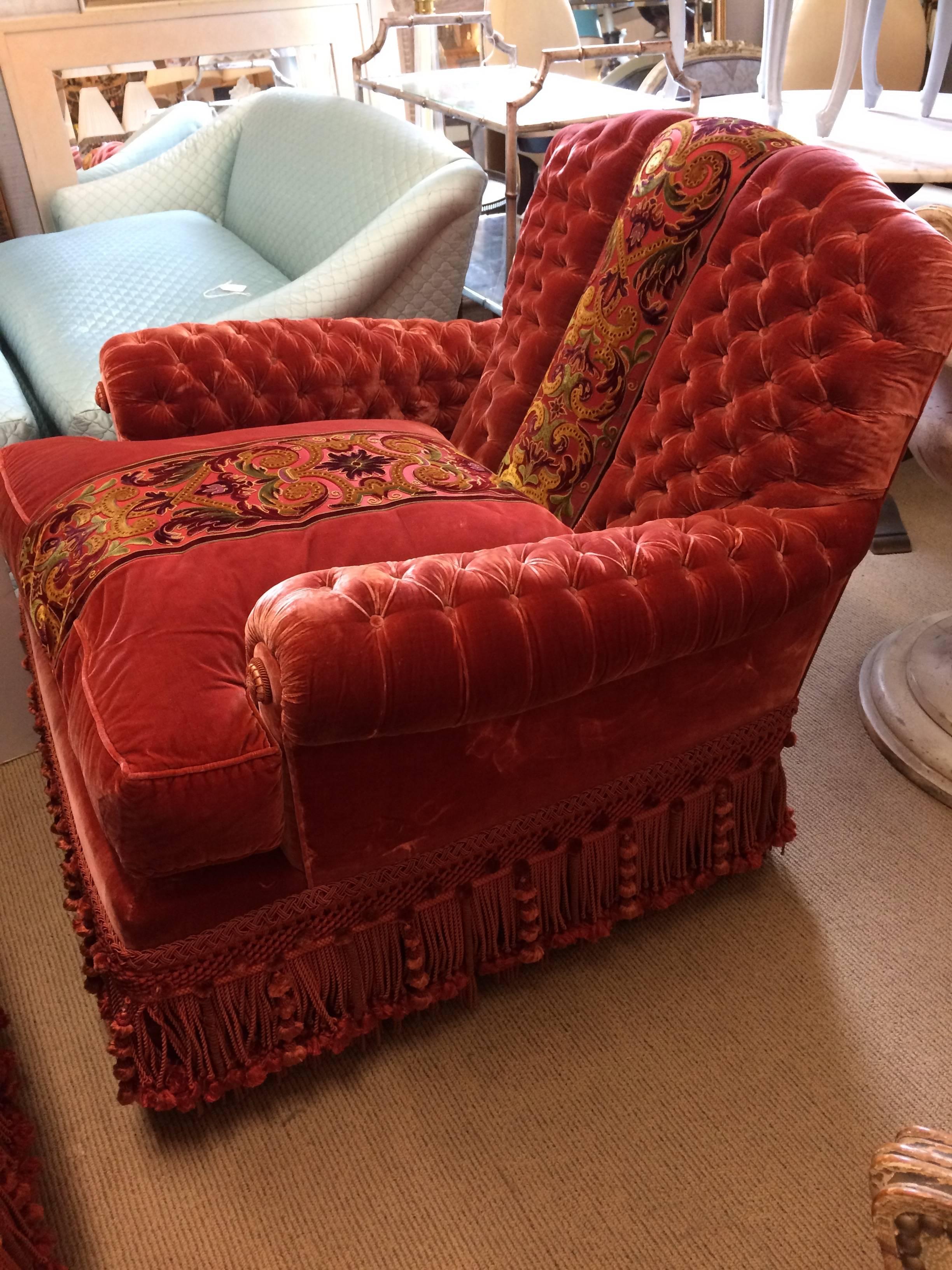 The penultimate pair of chic Parisian silk velvet club chairs, upholstered with amazing craftsmanship in an unusual soft color that on the artist's palette would
be a mix of red oxide, yellow oxide, raw umber and white. The ornately tufted back and