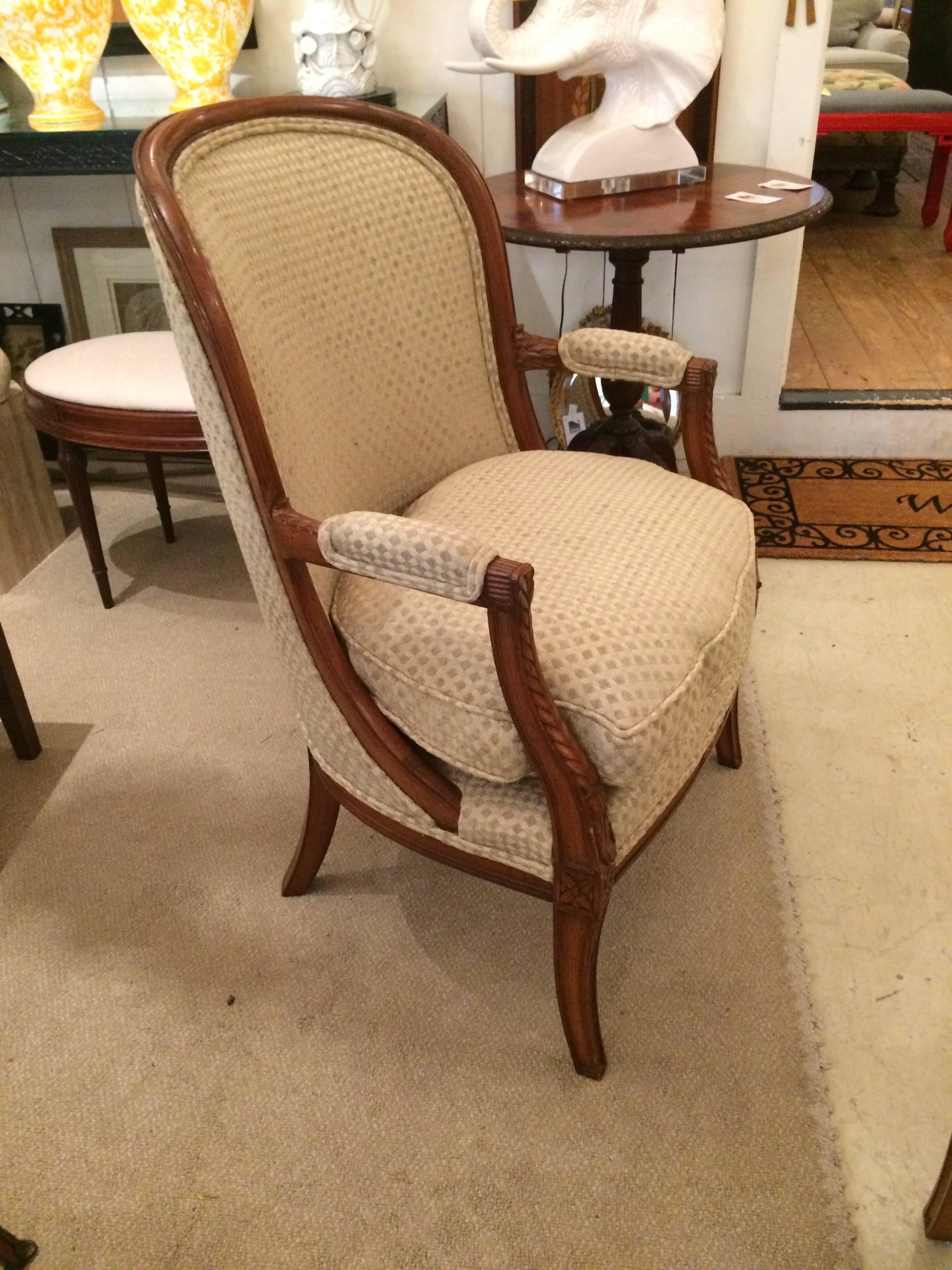 French pair of solid heavy walnut bergeres/tub chairs with champagne cut velvet upholstery in a diamond pattern and comfy down cushions. 
Arm height 27 inches.