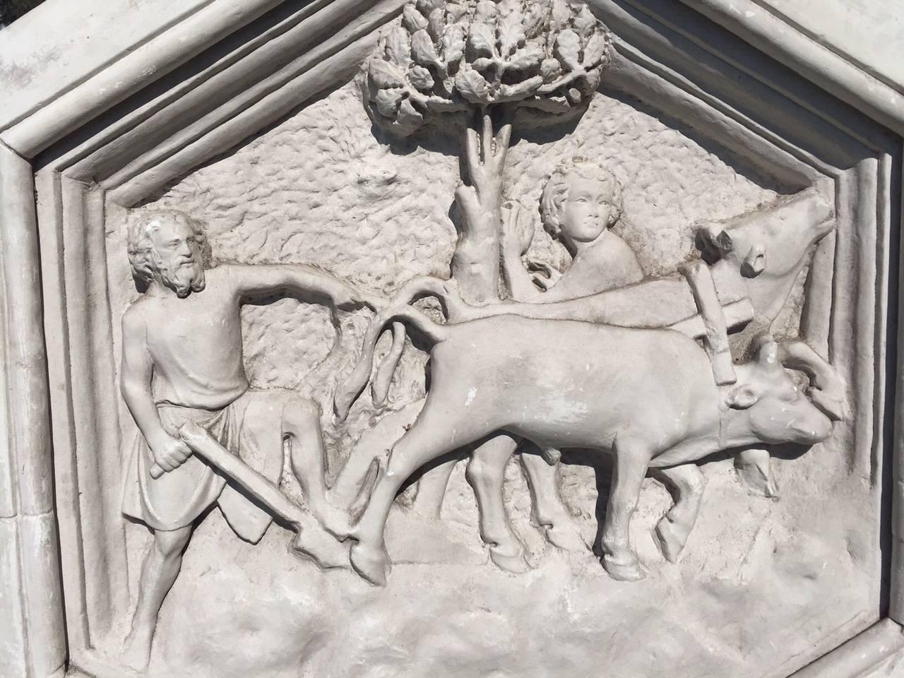 Bucolic bas relief plaster sculpture from a Belgian castle bought in Avignon, France. Measures: 33 ¼” in diameter and 4 ½” deep. It is plaster and depicts a man and boy plowing the fields with cattle.