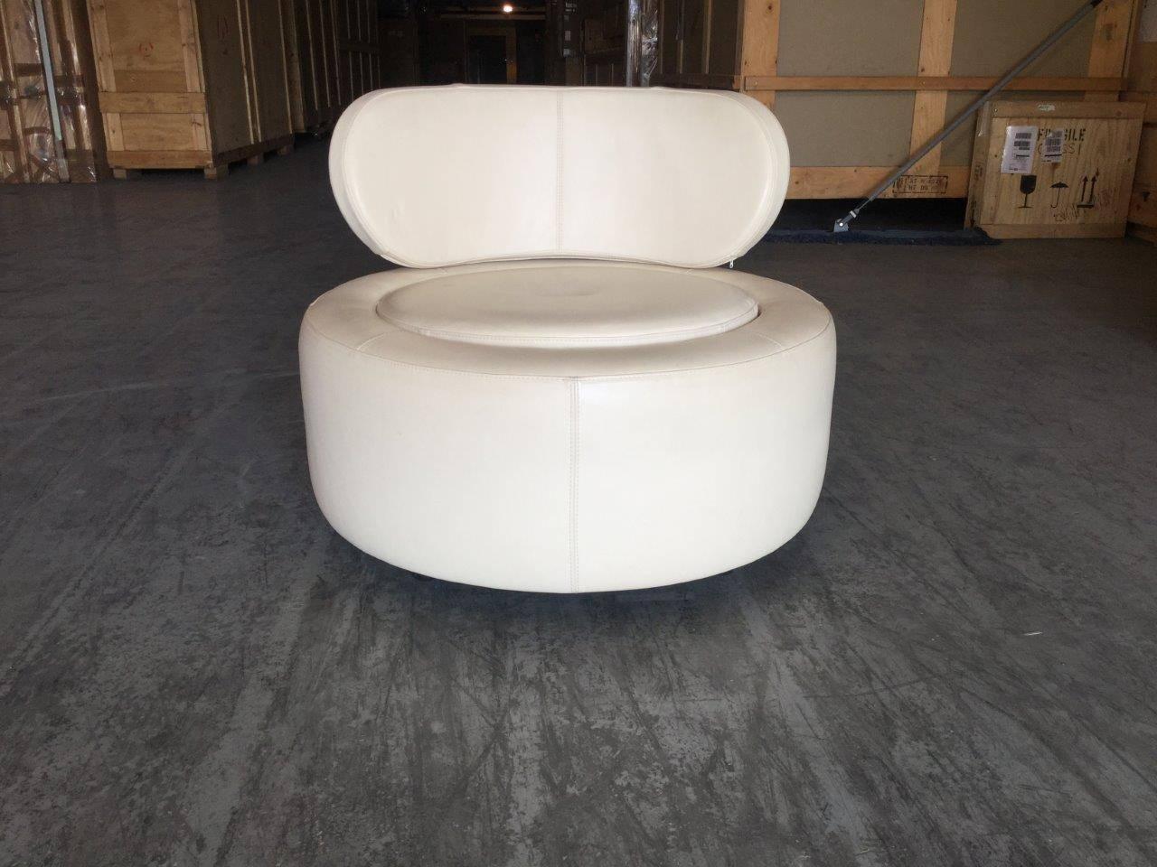 Pair of Danish modern white leather chairs. Made in Denmark, this extraordinary pair of large, round leather chairs are in mint condition. Both comfortable and functional, these chairs feature a couture design form and beautiful detailed stitching.