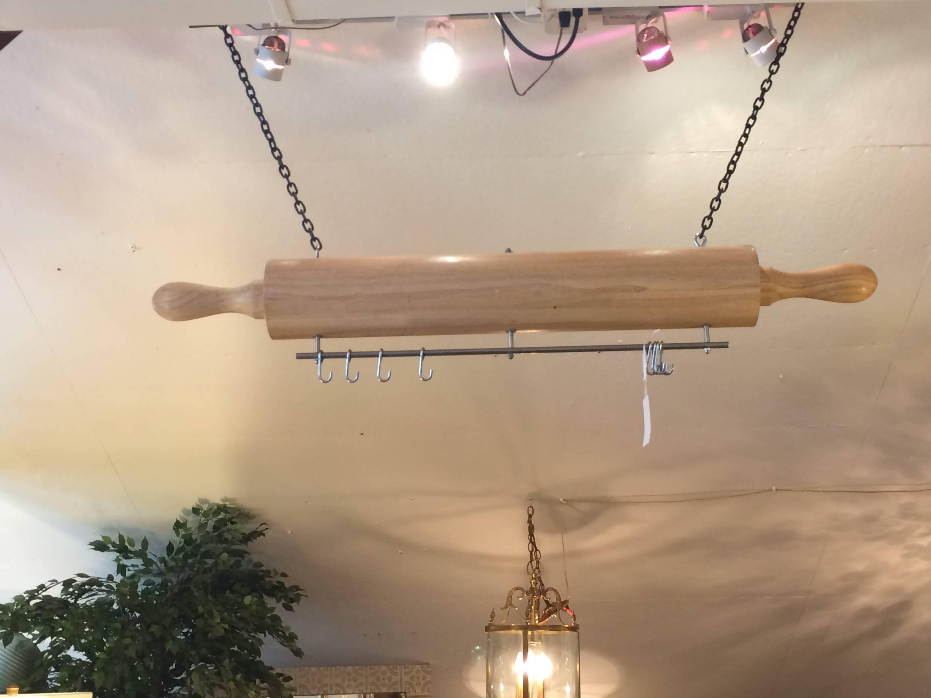 Super whimsical and fun pot hanger originally used in a Rhode Island bakery, in the shape of a monumental wooden rolling pin. Beautifully crafted and one of a kind.