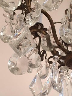 Matching Pair of Glitzy French Gilt Metal and Cut Glass Chandeliers