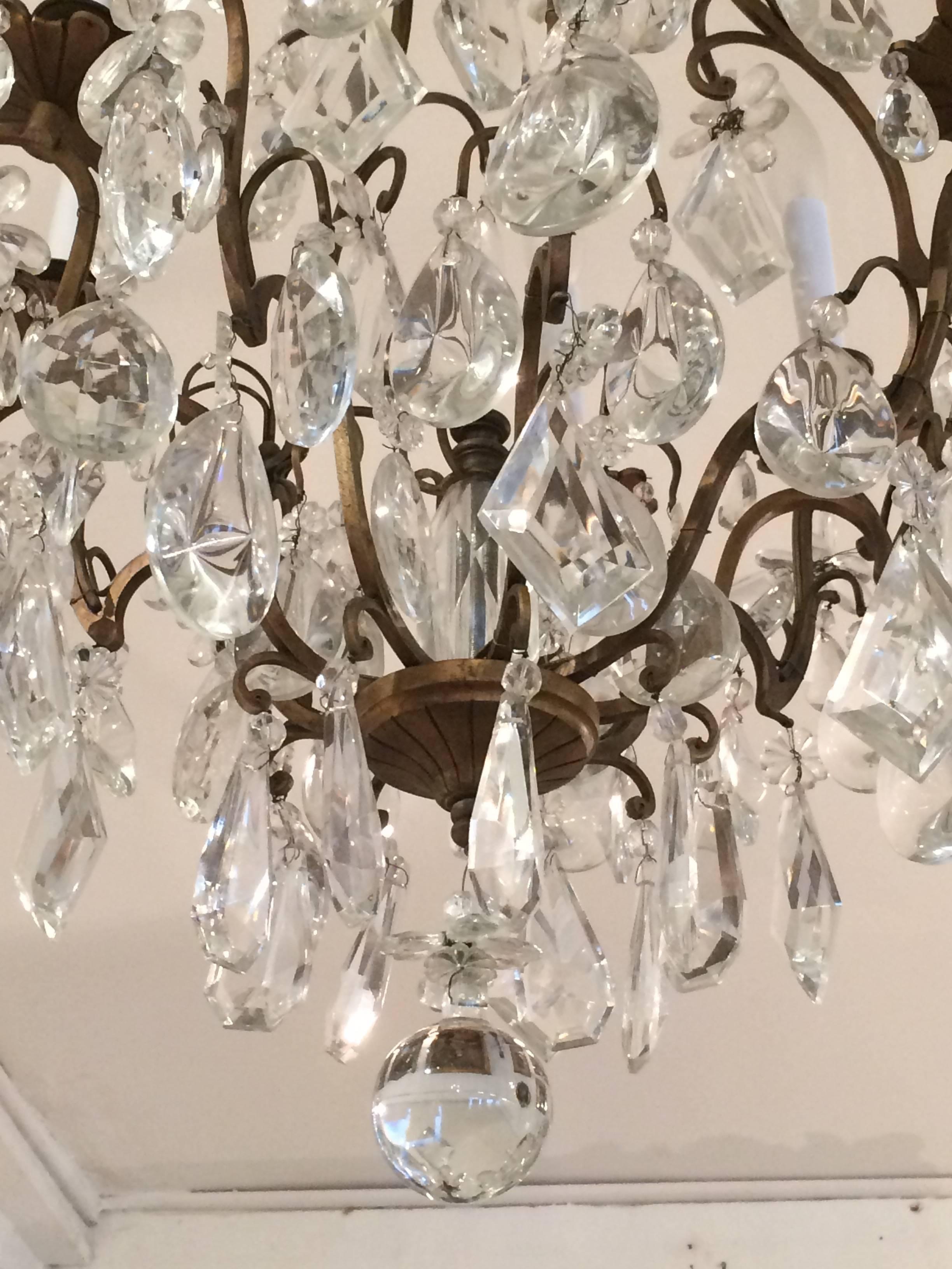 Matching Pair of Glitzy French Gilt Metal and Cut Glass Chandeliers In Excellent Condition For Sale In Hopewell, NJ