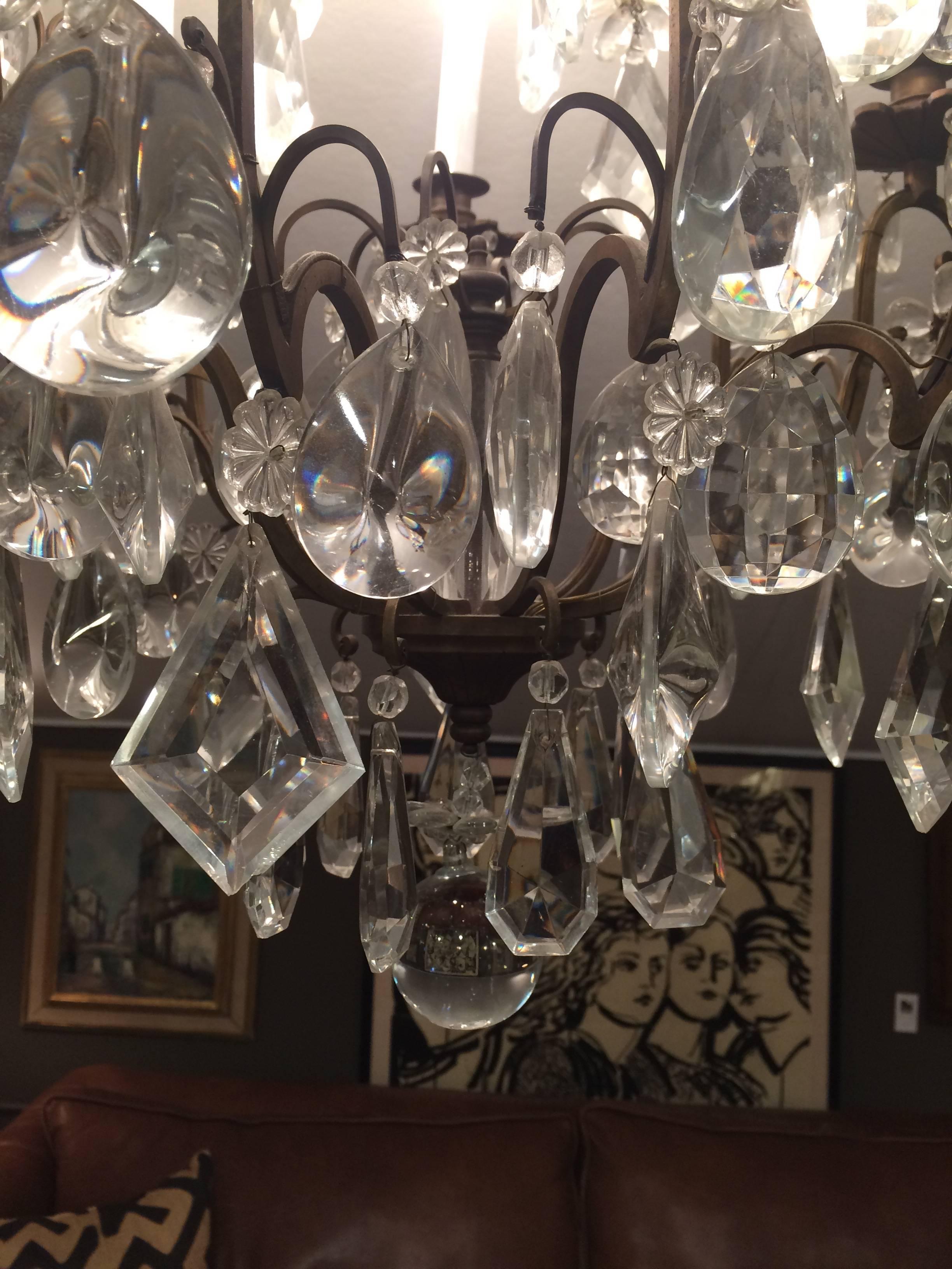 Mid-20th Century Matching Pair of Glitzy French Gilt Metal and Cut Glass Chandeliers For Sale