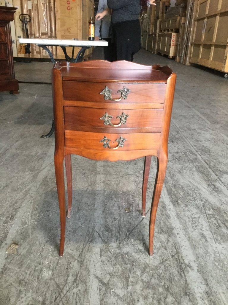 Refined pair of Louis XV-style French cherry night tables having three drawers and original
brass hardware. Beautiful and finished on all sides.

 