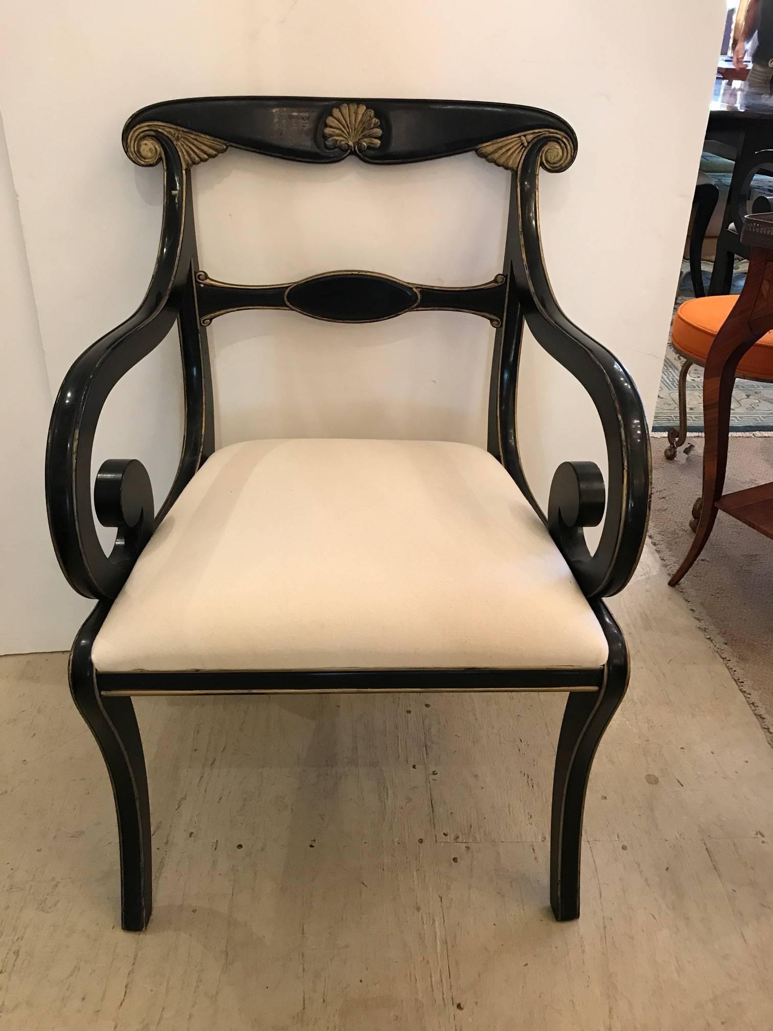 Beautiful ebonized carved wood dining chairs with gold leaf embellishments and newly upholstered white duck seats. Includes two arm chairs and six side chairs.
Six side chairs 34.5