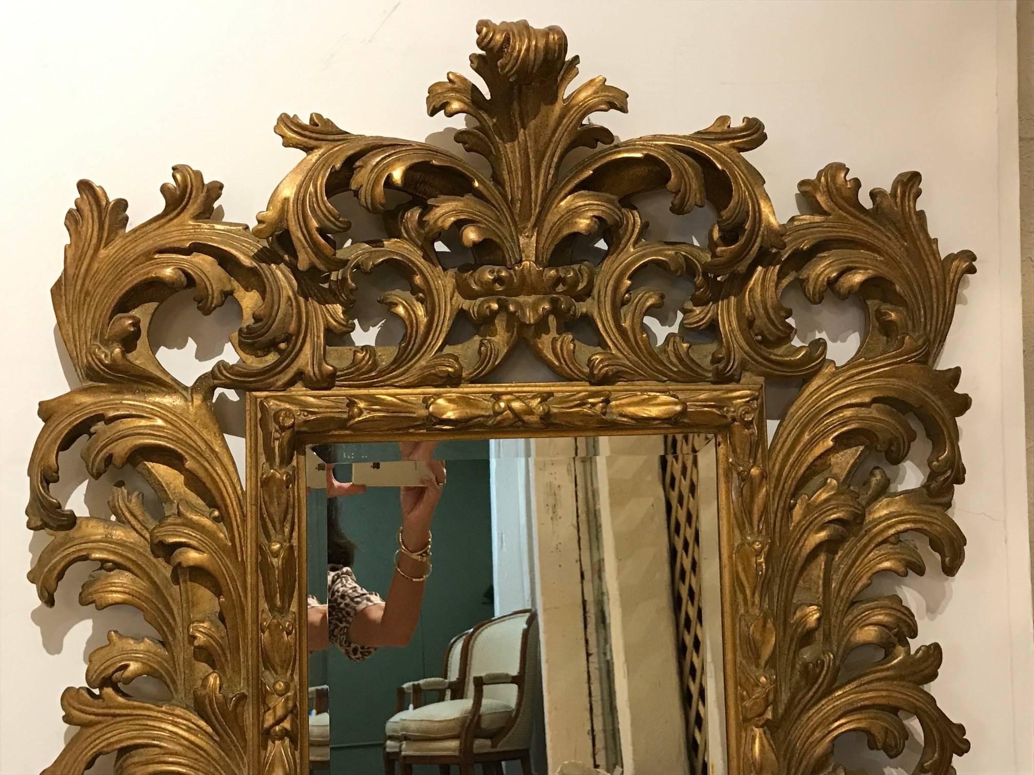 Gorgeous fancy carved Venetian style giltwood mirror by Carvers Guild.
   
     