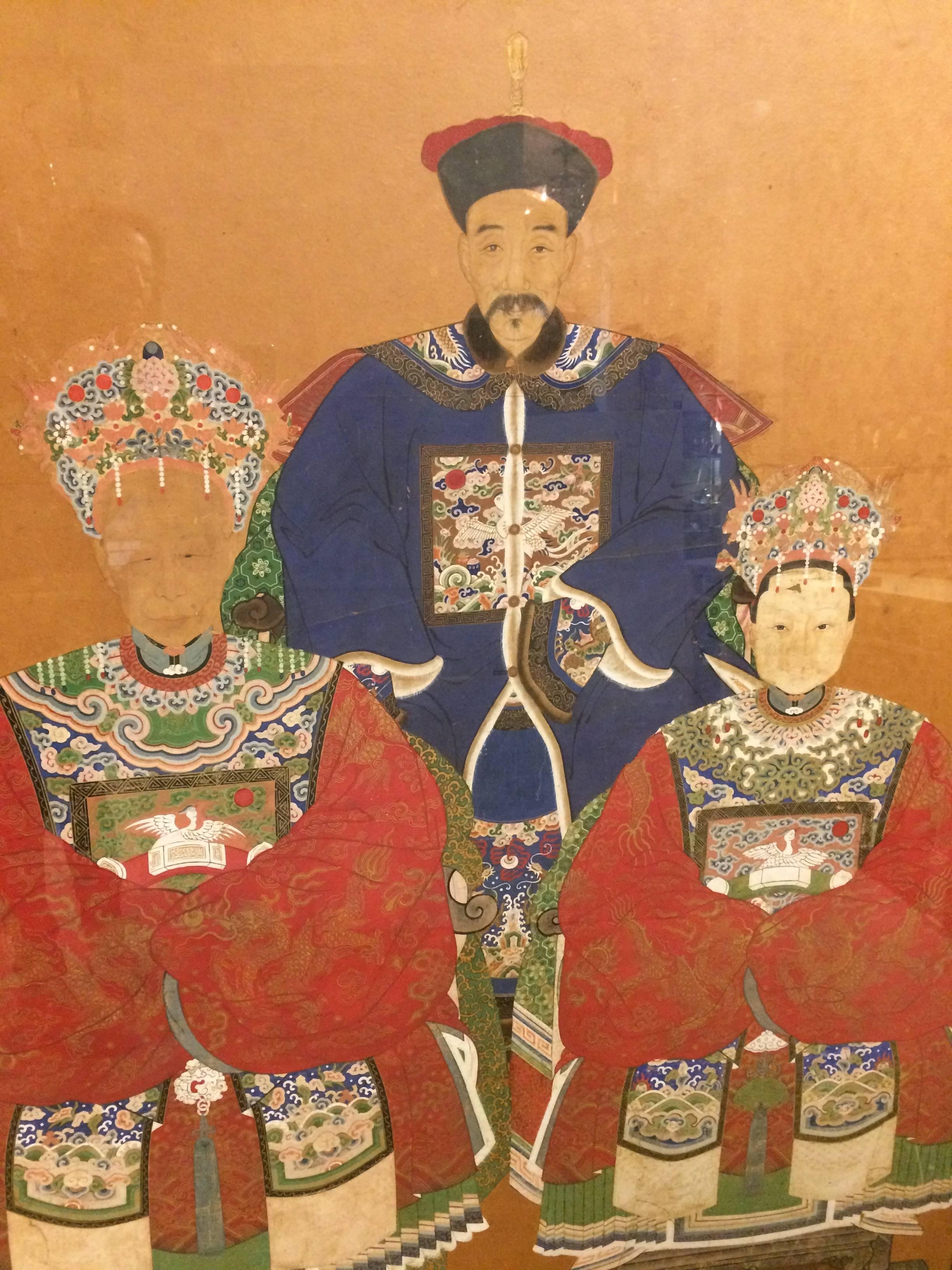 Gorgeous and impressive in scale and age, this is an 18th century original watercolor on parchment of three Chinese royalty rendered with meticulous detail and color palette.