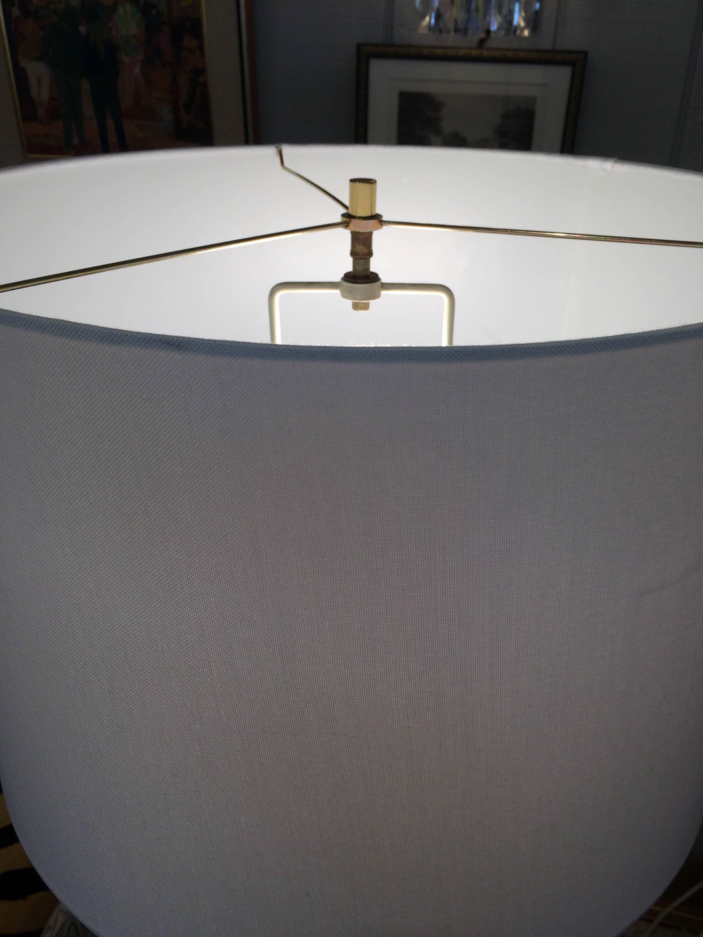 Very stylish Mid-Century Modern floor lamp, Danish inspired, with a wish bonesque shape in teak and brass. In superb mint condition. Can take a three way bulb.
Base is 10 x 10
Note: Matching pair of table lamps are available.