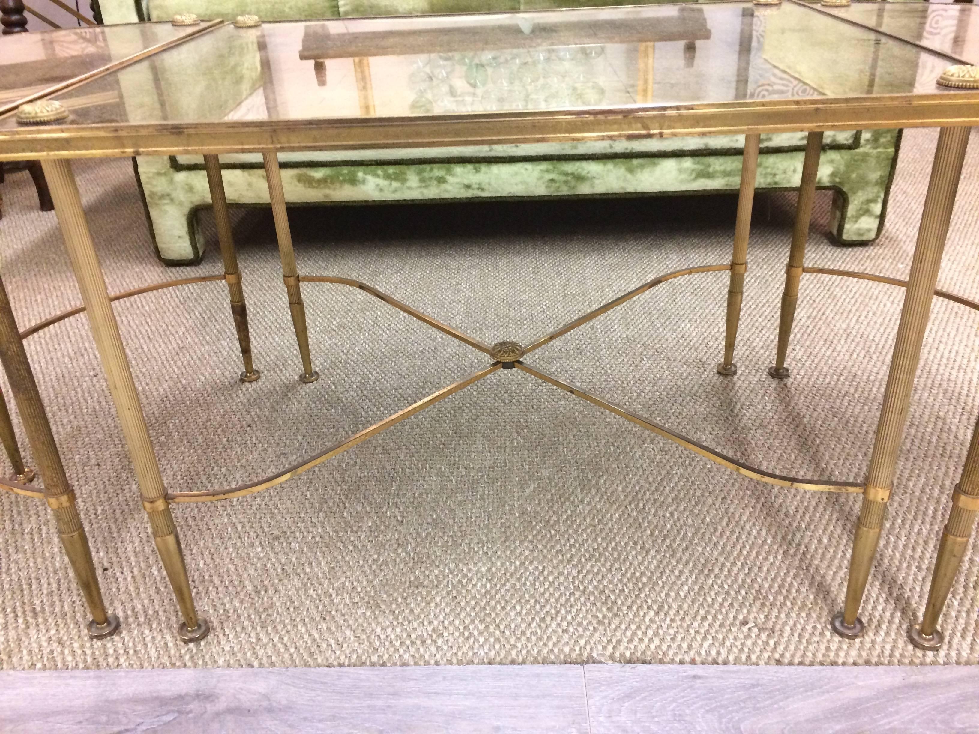 Clever three-piece coffee table having a center rectangle and two separate curved demilune shaped tables on each end; when pushed together it's an oblong. Brass with a neoclassical style and a gold mirrored top. Very glamorous.
Just middle section