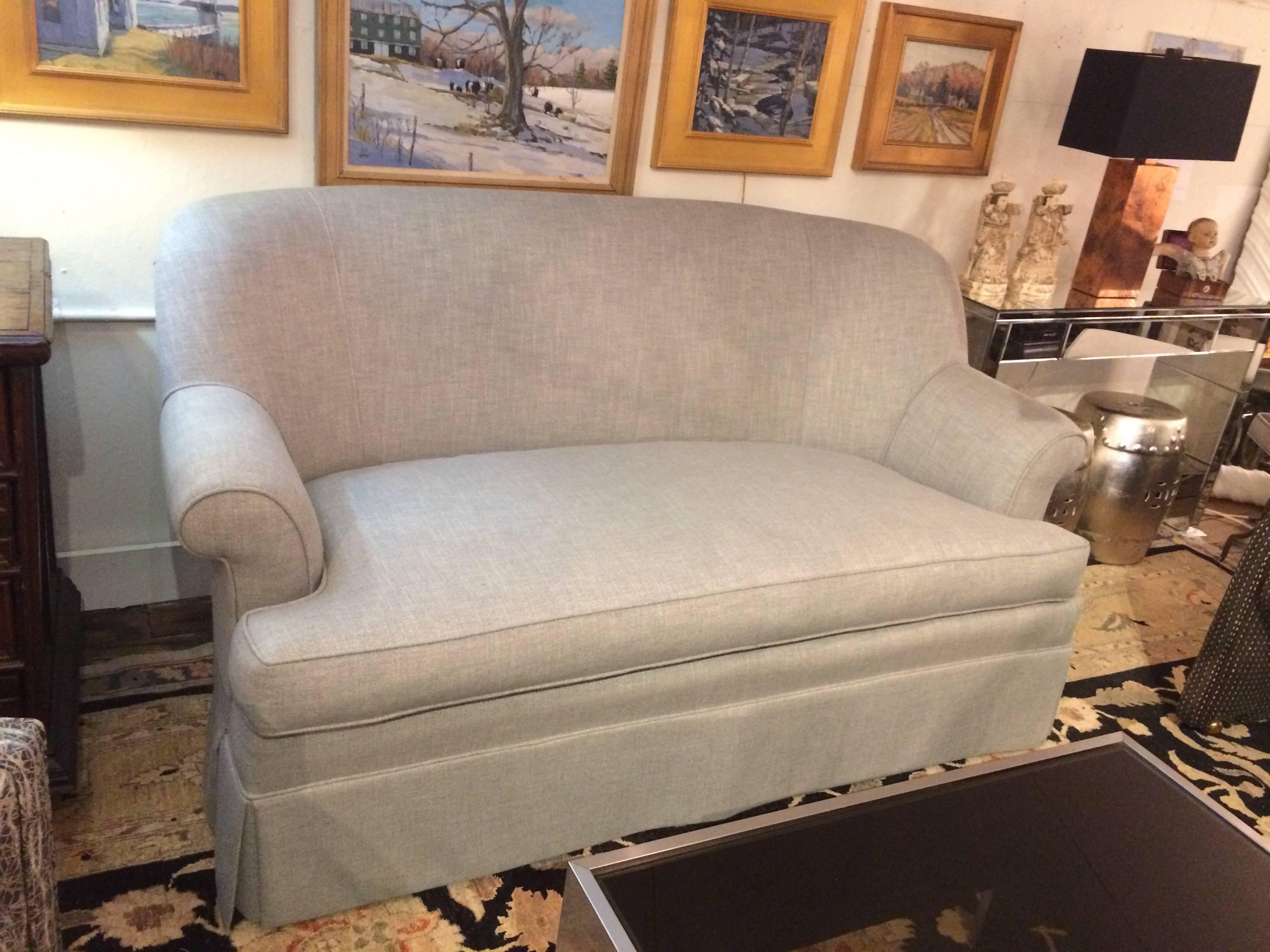 Two tailored platinum gray linen skirted loveseats sofas with fabulous grey and white contemporary pillows included. Seat depth w/o pillows is 28.
Arm height: 27

Will split the pair.