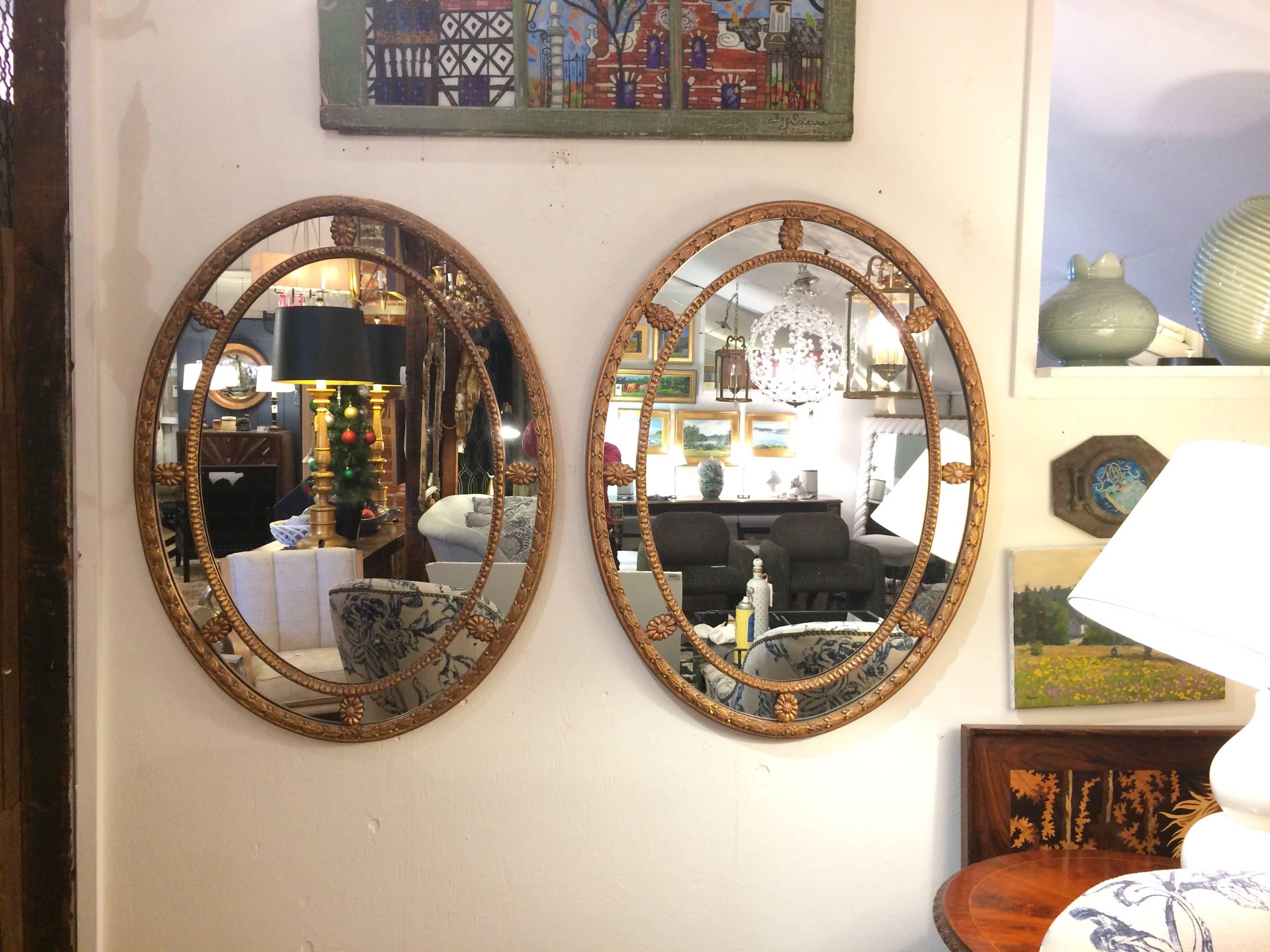 Two elegant oval vintage mirrors of large size, having lovely giltwood frames.