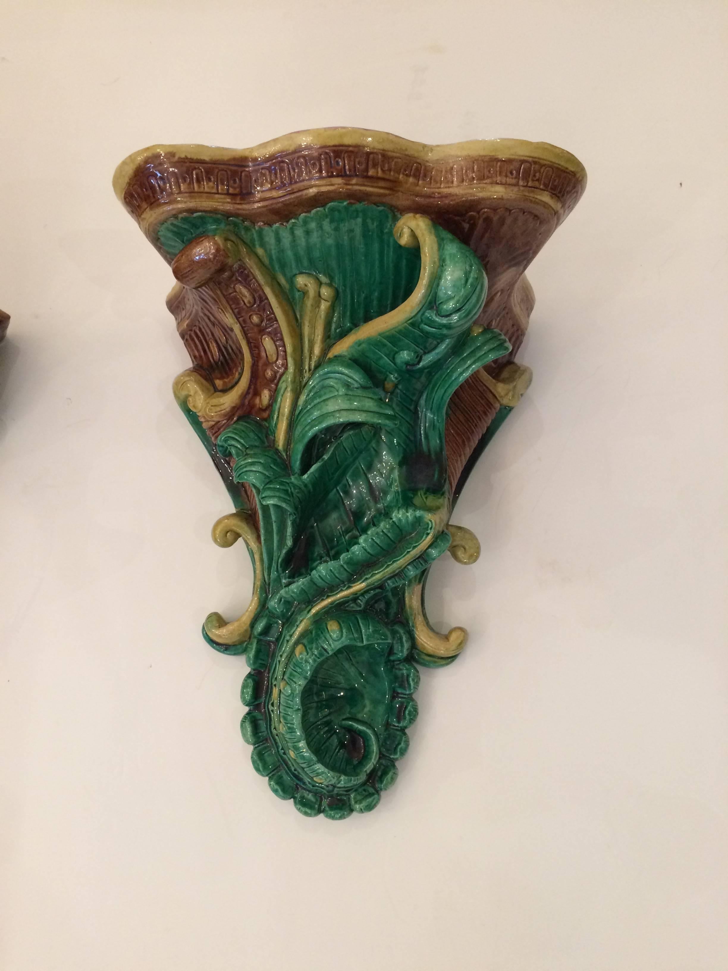 Two beautiful Majolica wall brackets in striking emerald green, brown and gold with wonderful leaf motif.