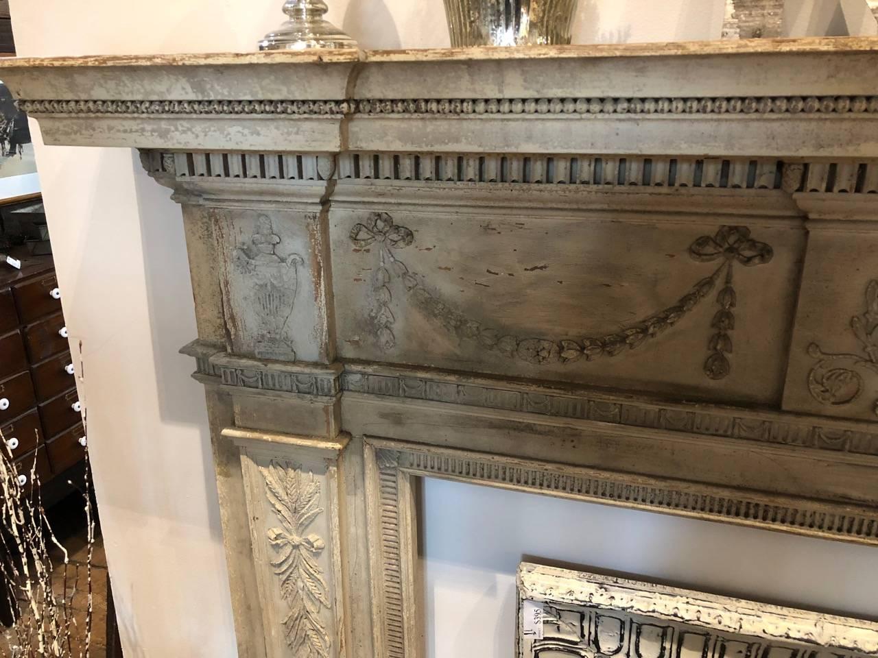 Gorgeous fireplace mantel in a greyish off-white composition with Classic Federal Revival design. A 19th century reproduction of an 18th century mantel in the Blair House in Washington DC. Opening measures 52 wide and 40 high.

 