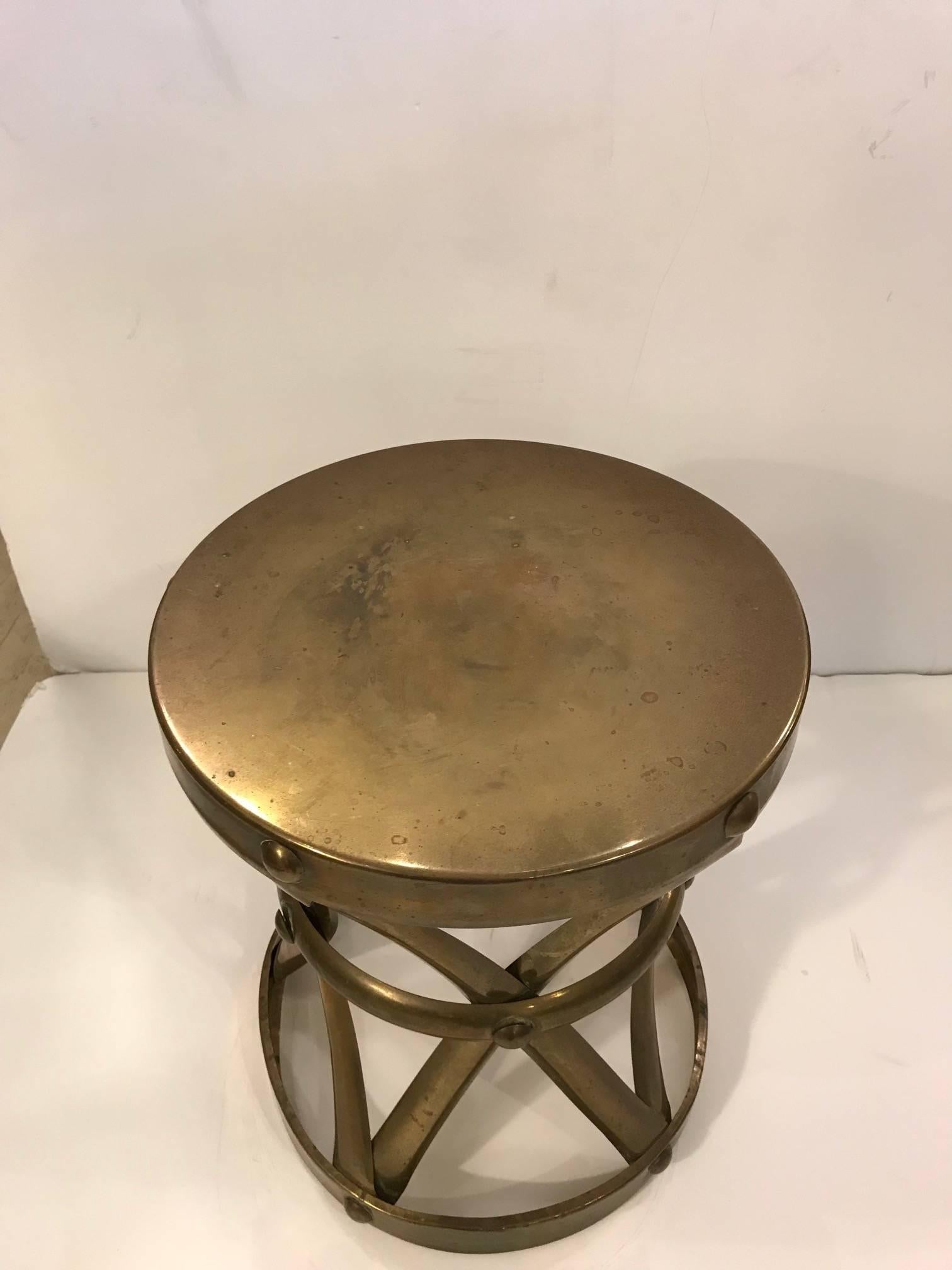 Great looking brass martini table having criss crosses with circular band.
