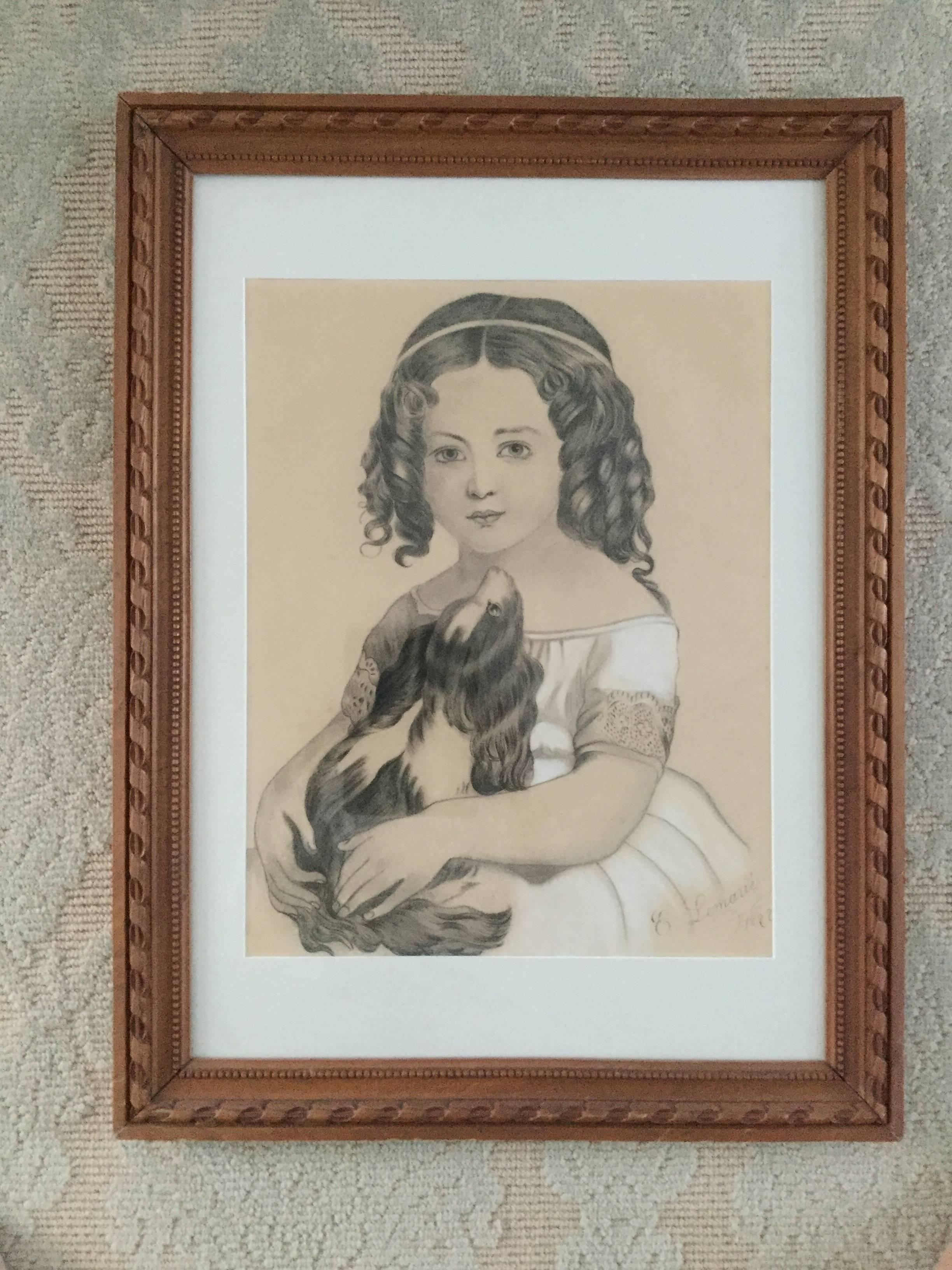 A beautifully rendered 19th century pencil and white chalk portrait of a young girl and her dog, signed E. Lemarié and dated 1897. Meticulous detail, especially the lace on the girl's sleeve and the sumptuous curls of her hair. The frame is in the