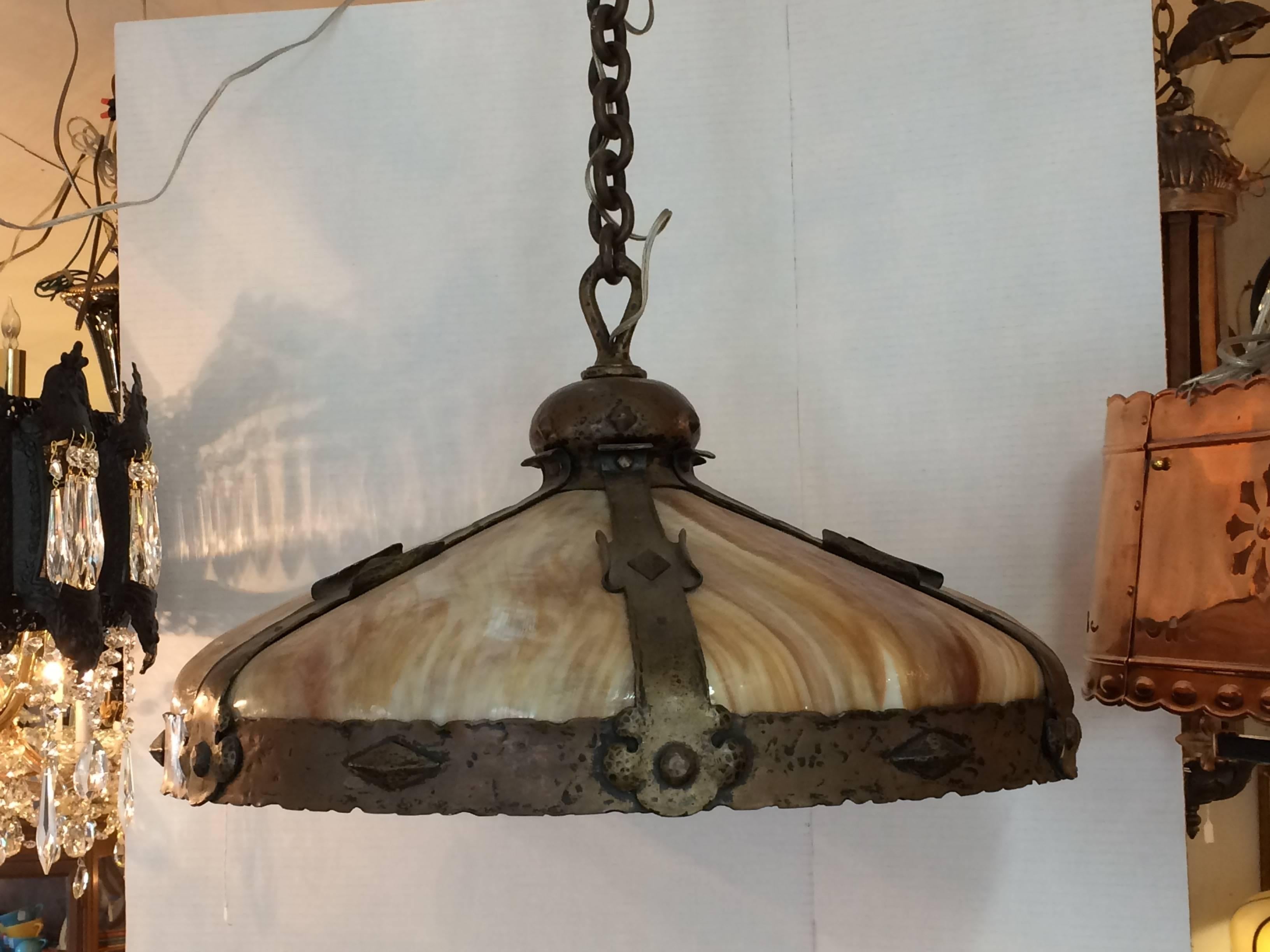 Magnificent and impressive in scale, a true Arts & Crafts dome shaped light fixture having gorgeous 