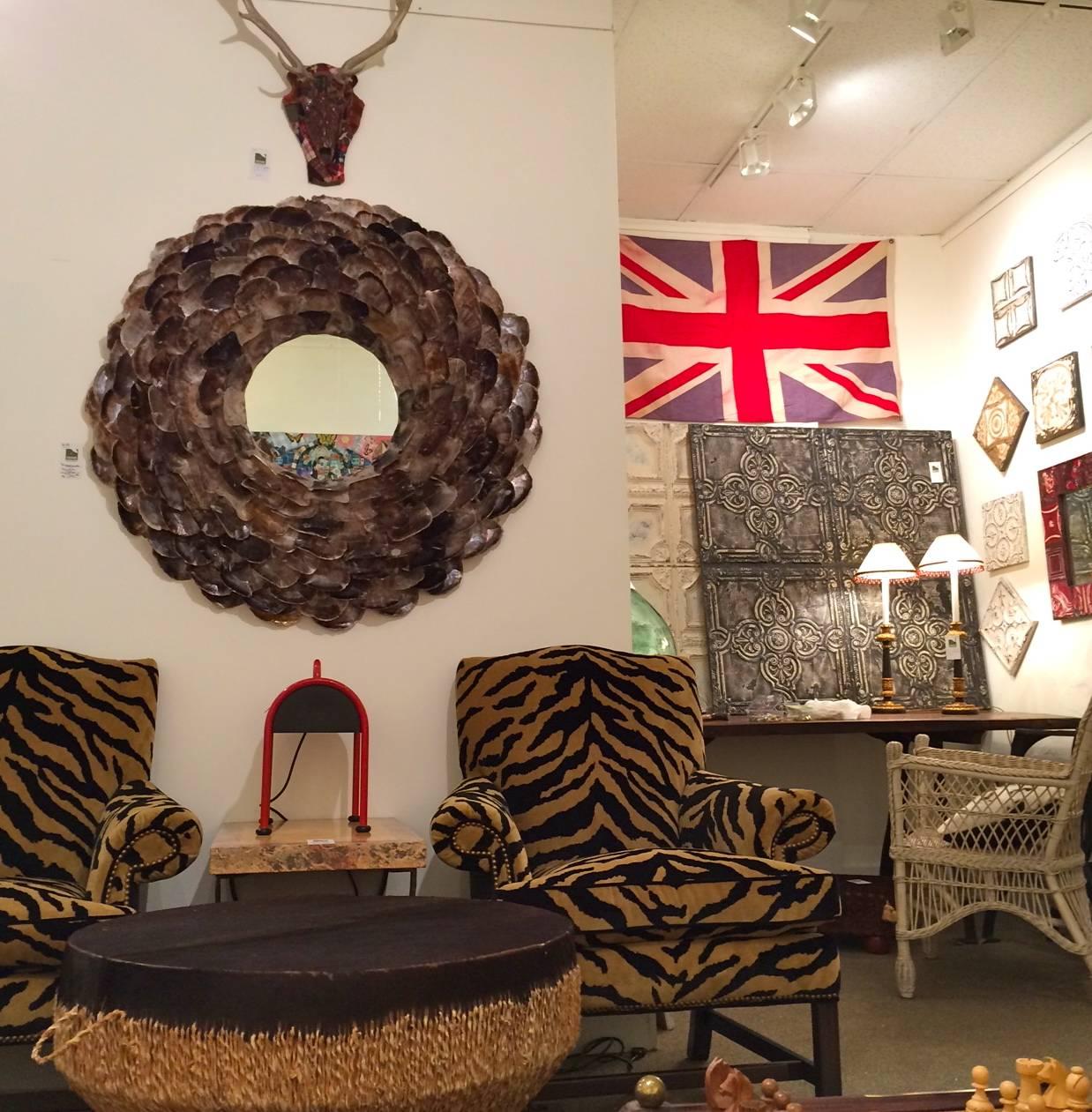 Wonderful super large round mirror with multiple tiers of abalone shells that create the frame, having pearlescent mother-of-pearl neutral earth tones. 
Measures: 8