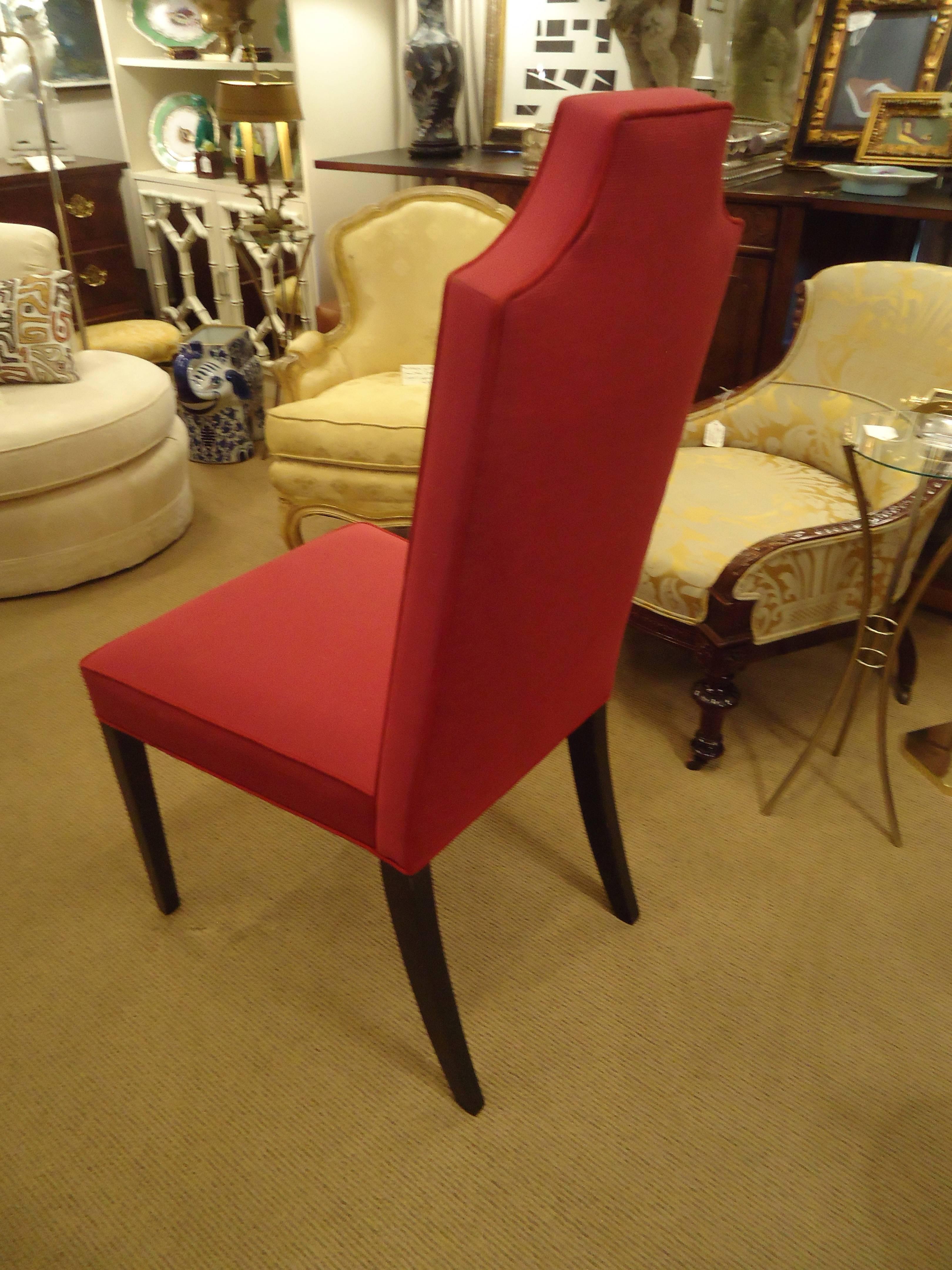 Very stylish set of upholstered dining chairs with tall backs, dark mahogany legs and a raspberry cotton fabric.