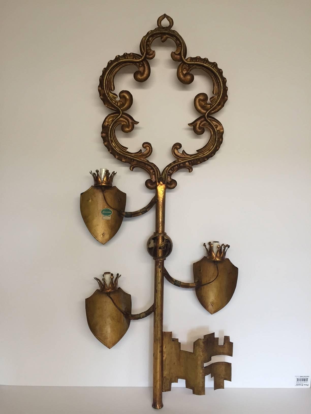 Very unusual decorative sconce in the shape of a key.  Newly rewired with three lights.