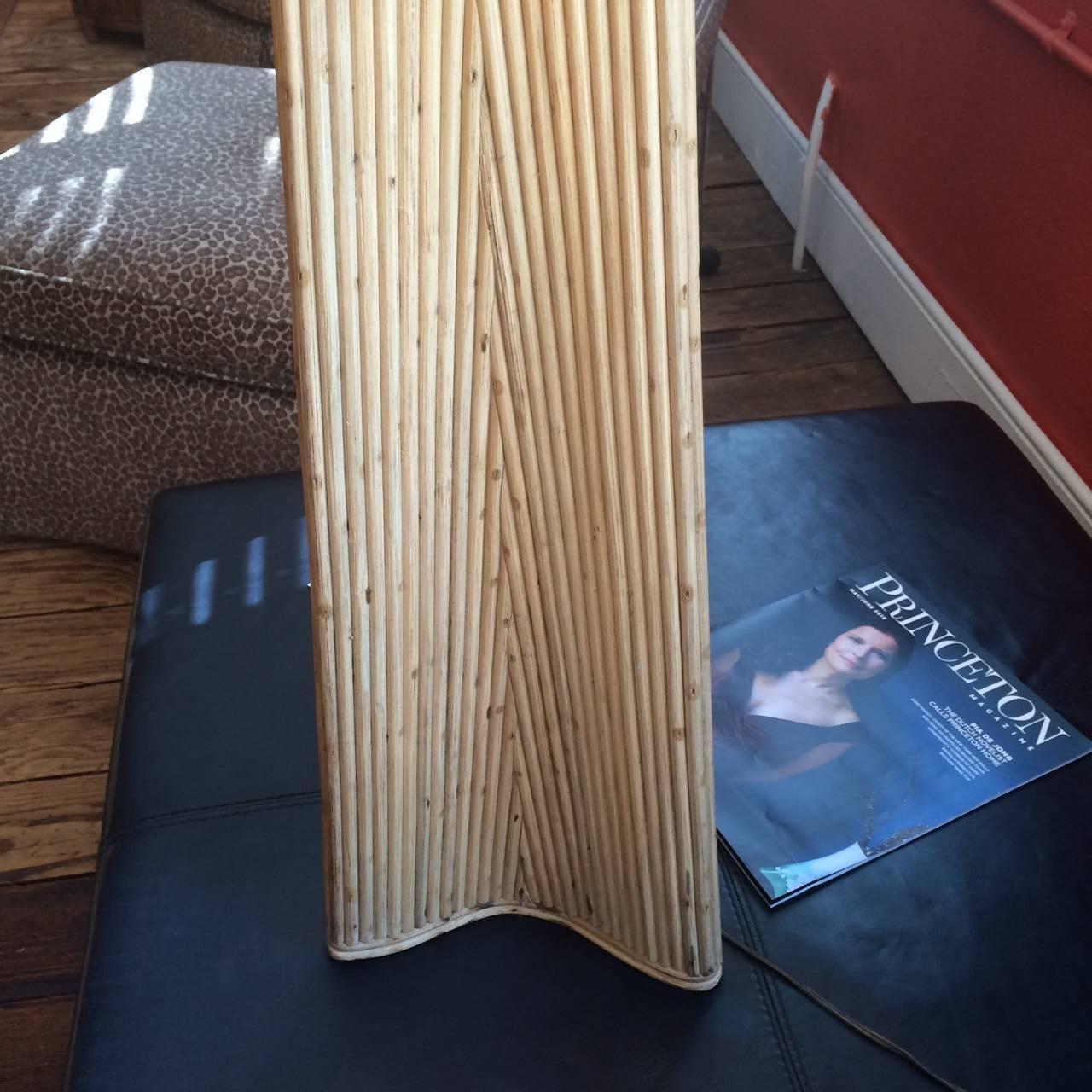 Pair of fabulously tall midcentury rattan Palm Springs style lamps with original woven rattan shades. Newly wired, new Asian inspired finials.