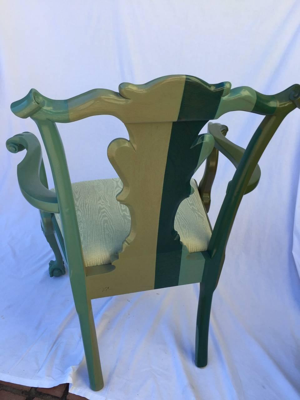 Hand stained Chippendale style hardwood chair in soft shades of green from very dark green to a blue green and seafoam. Seat is upholstered in a silk blend moire. Initials underside.
Measures: Seat width 24".
Seat height 19".
 

 