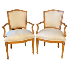 Elegant Pair of French Antique Carved Walnut Louis XVI Dining Arm Chairs