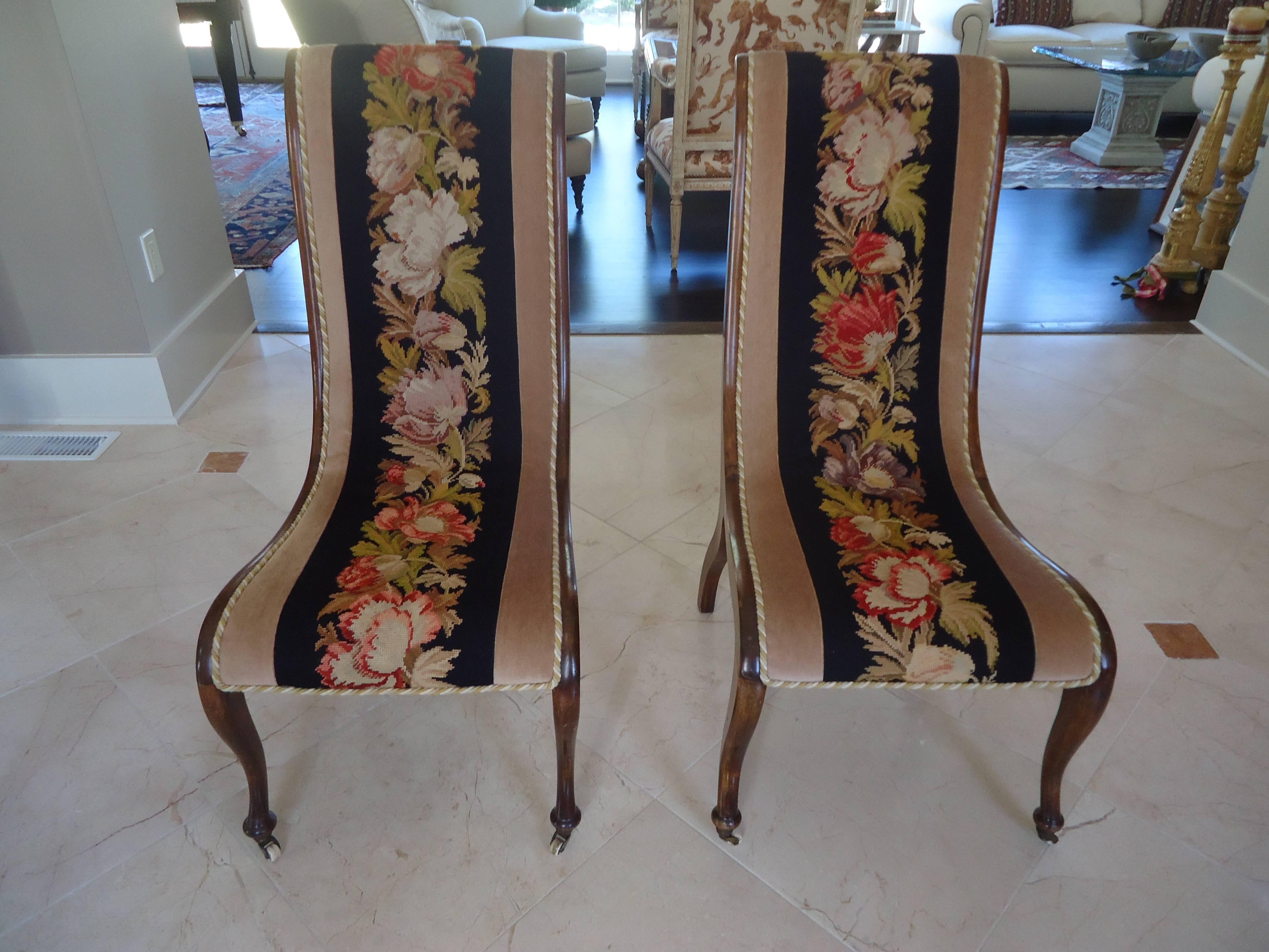 Elegant curved armless chairs with mahogany frames, original horsehair covered with needlepoint and velvet and decorative cording, lovely cabriole legs on casters.