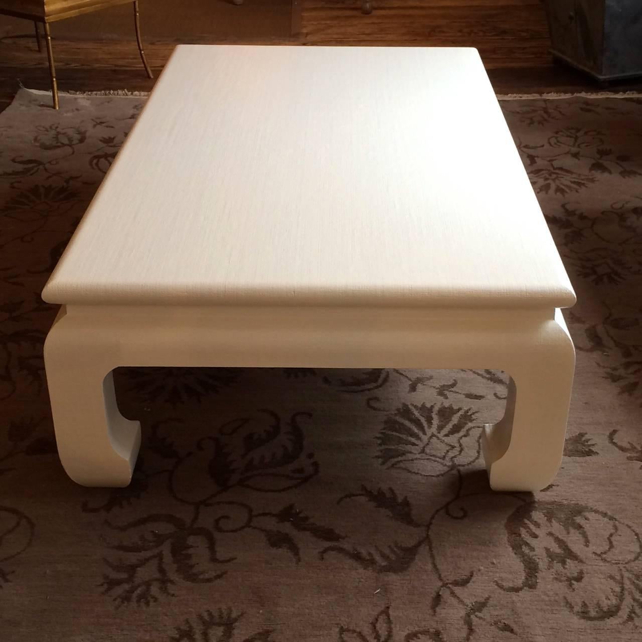 An Asian inspired coffee table attributed to Karl Springer in a white lacquered textile finish. No signature found.