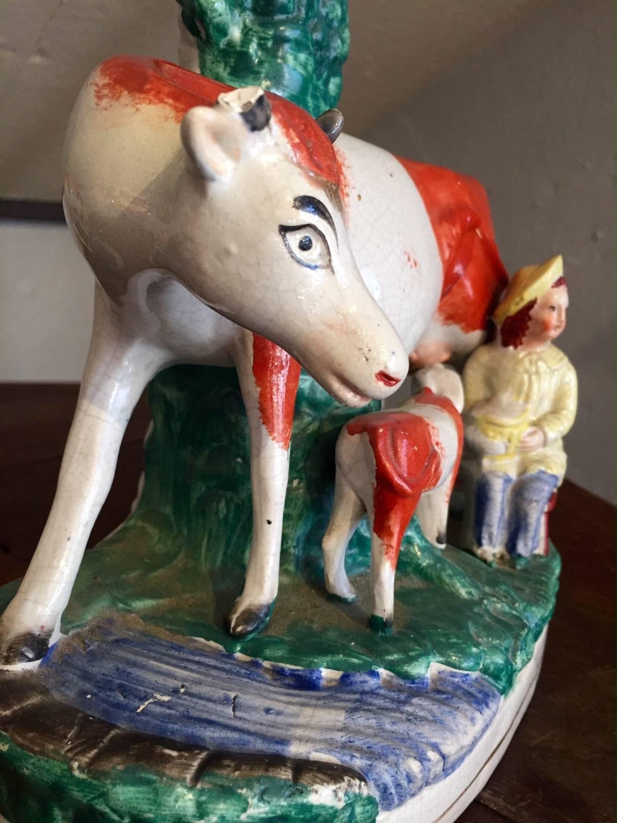 English Charming and Rare Pair of Staffordshire Cow Vases