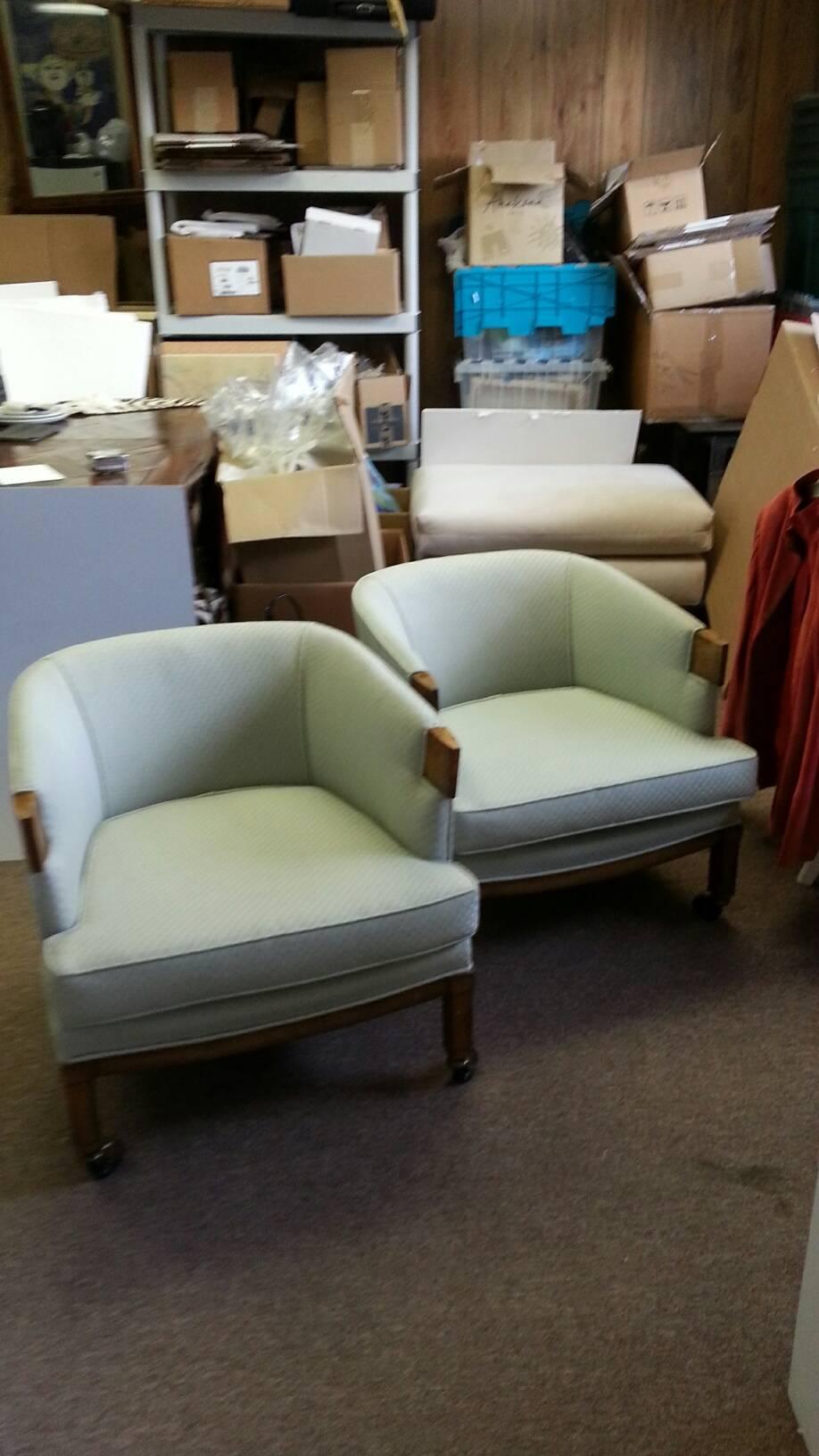 Chic pair of Mid-Century barrel chairs on castors with burl arms and fruitwood base. Celadon blue fabric from the 1970s.
 